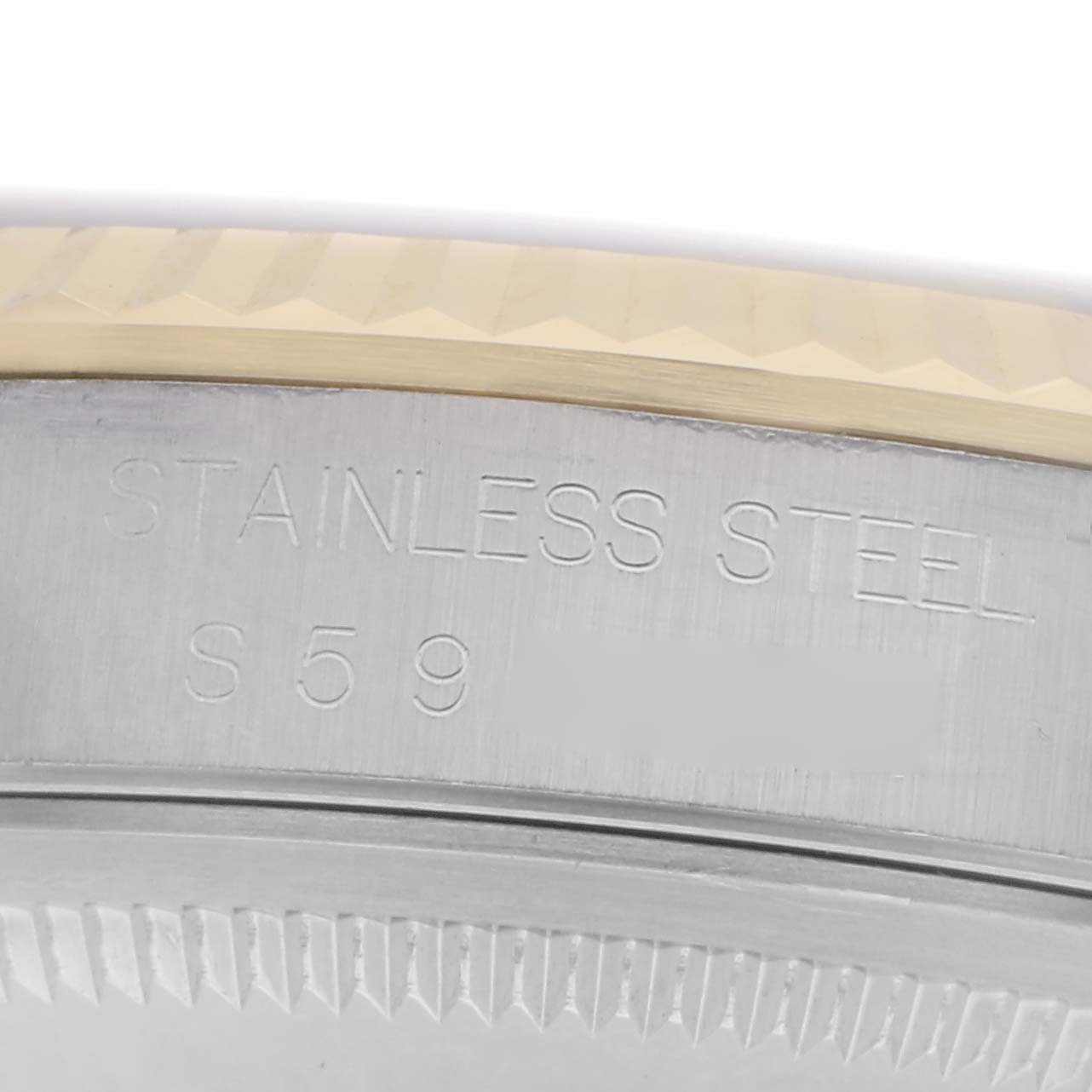 The image shows a close-up of the Rolex Datejust 16233 Men
s Steel and Gold (two tone) White Dial 16233 Men
s Steel and Gold (two tone) White Dial
s case, highlighting the stainless steel material and a portion of the bezel.