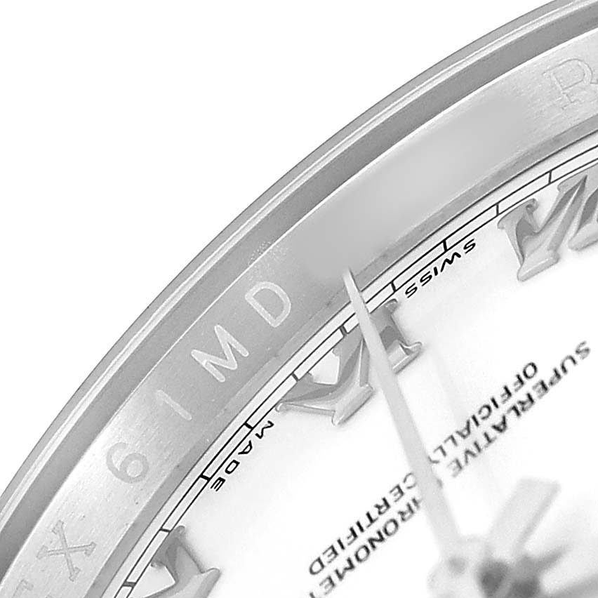The image shows a partial view of the bezel and dial on the Rolex Datejust 116234 Men's Stainless Steel White Dial, displaying Roman numerals and part of the branding.
