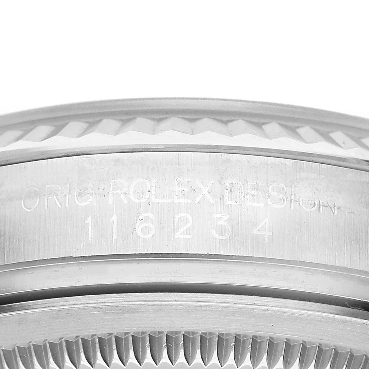 The image shows a close-up side view of the bezel and case side of a Rolex Datejust 116234 Men's Stainless Steel White Dial, featuring engraved details.