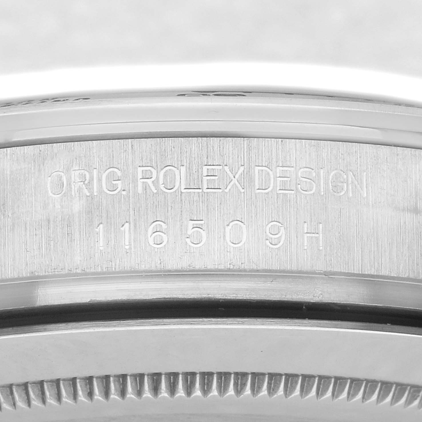 The image shows a close-up of the side engraving on a Rolex Daytona 116509 Men
s White Gold Blue Dial 116509 Men
s White Gold Blue Dial watch, displaying "ORIG. ROLEX DESIGN 116509H."
