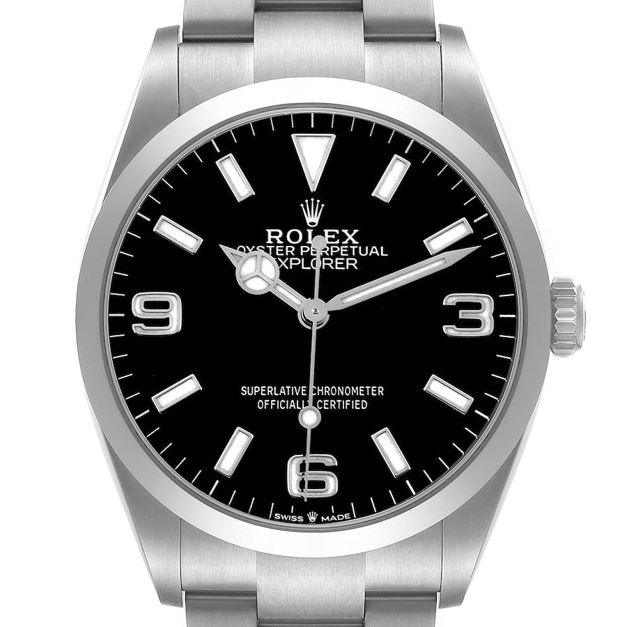 The Rolex Explorer watch is shown from the front, displaying the dial, hands, and part of the bracelet.
