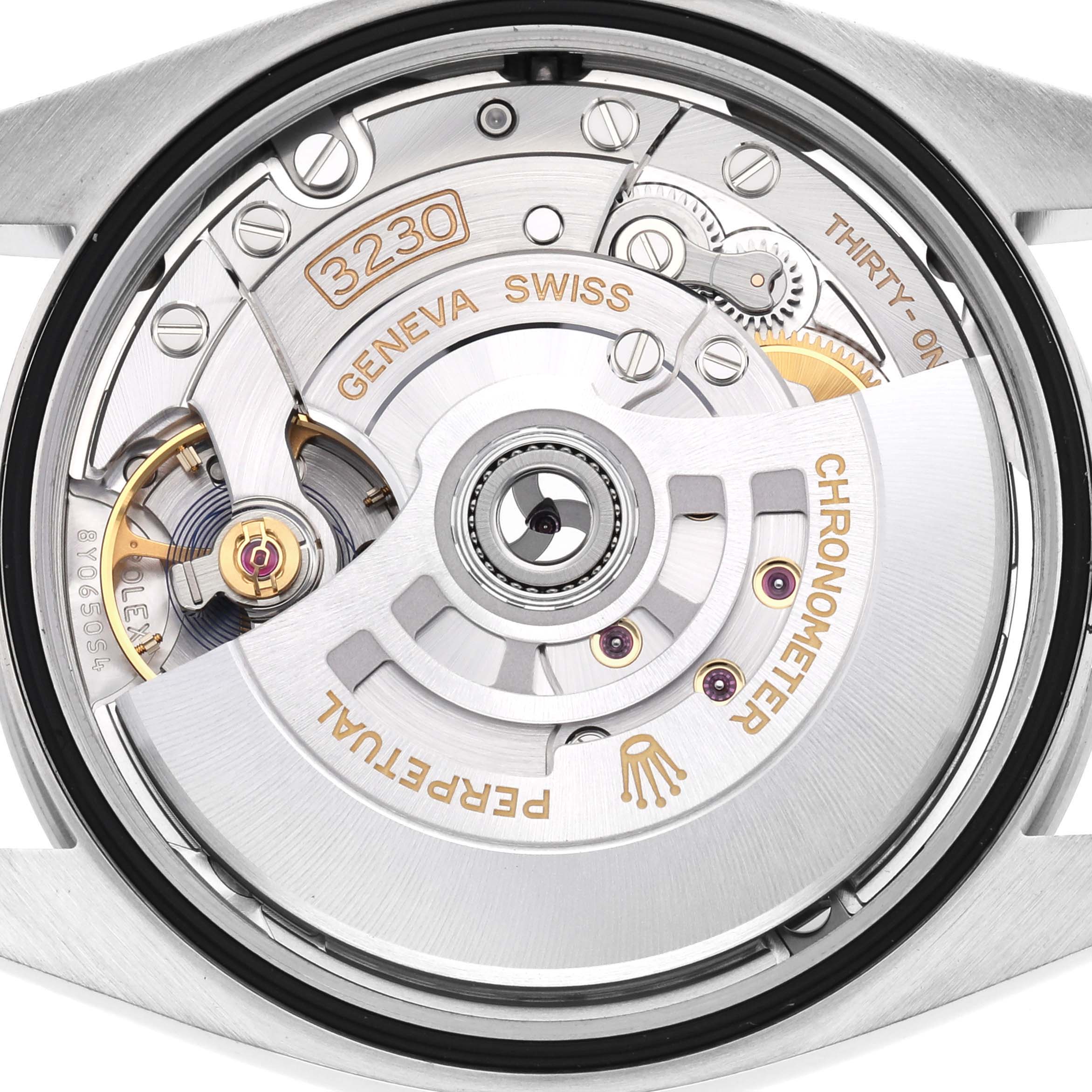 The image shows the movement of a Rolex Explorer 124270 Men
s Stainless Steel Black Dial 124270 Men
s Stainless Steel Black Dial, highlighting the rotor and intricate inner mechanics from a top-down angle.