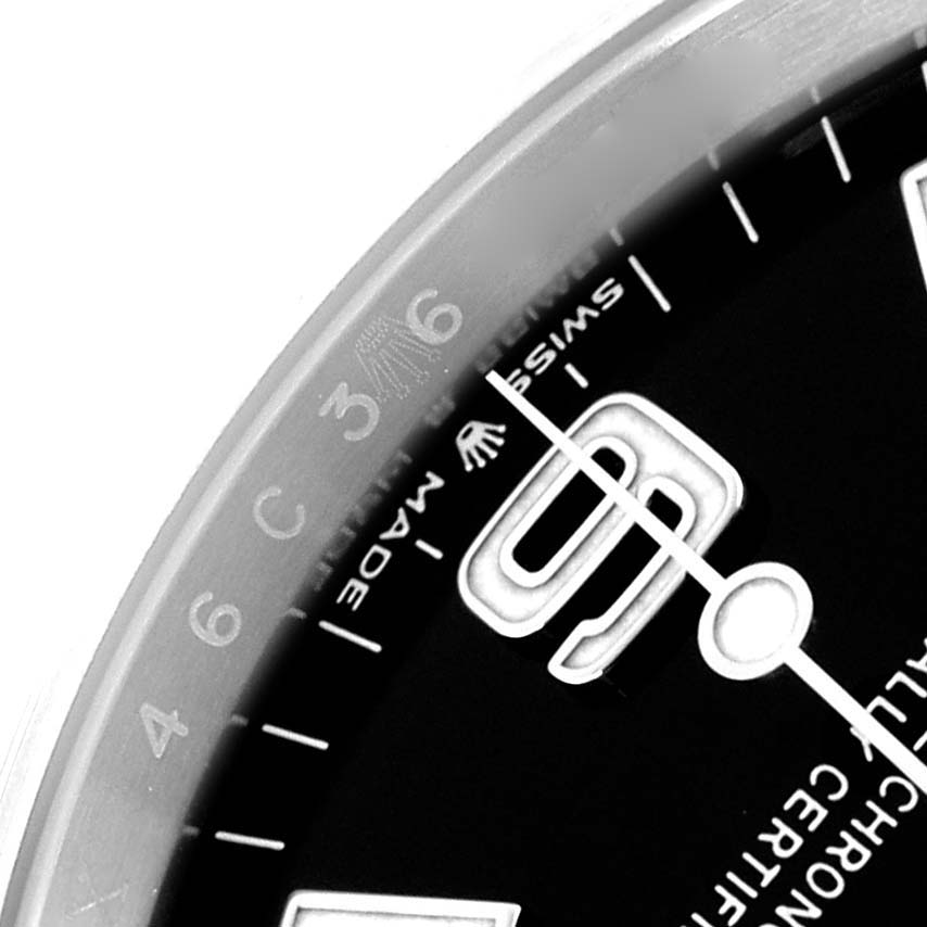 The image shows a close-up of the Rolex Explorer 124270 Men
s Stainless Steel Black Dial 124270 Men
s Stainless Steel Black Dial watch face, focusing on the numerals and text on the dial edge.
