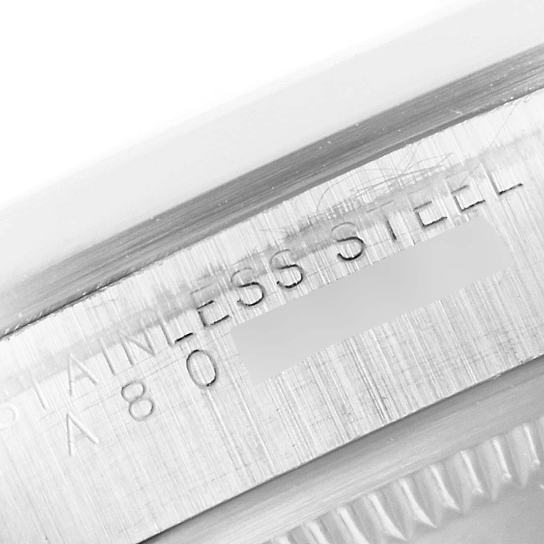 This close-up image shows the engraved stainless steel marking on the side of a Rolex Explorer 14270 Men's Stainless Steel Black Dial 14270 Men's Stainless Steel Black Dial watch.