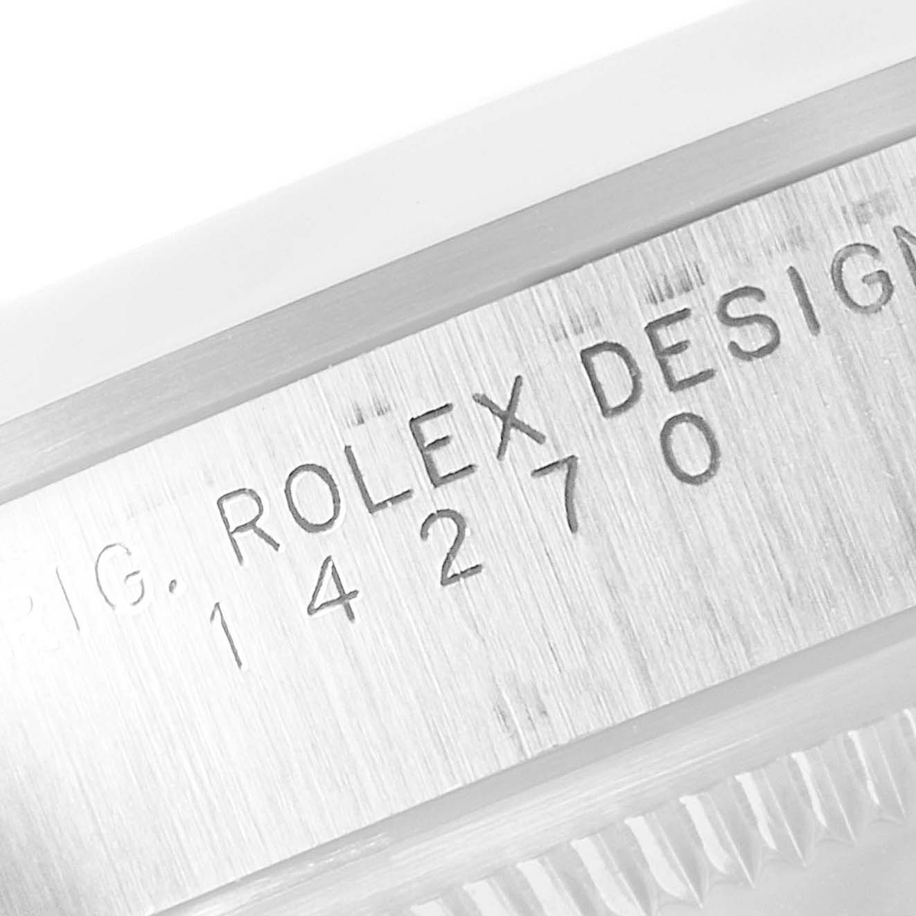 The image shows a close-up of the case side with the serial number engraving of a Rolex Explorer 14270 Men's Stainless Steel Black Dial 14270 Men's Stainless Steel Black Dial watch.