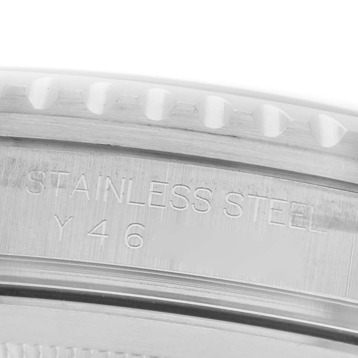 The image shows a close-up of the bezel and engraved side of a Rolex GMT-Master 16710 Men
s Stainless Steel Black Dial 16710 Men
s Stainless Steel Black Dial watch, highlighting the stainless steel material.