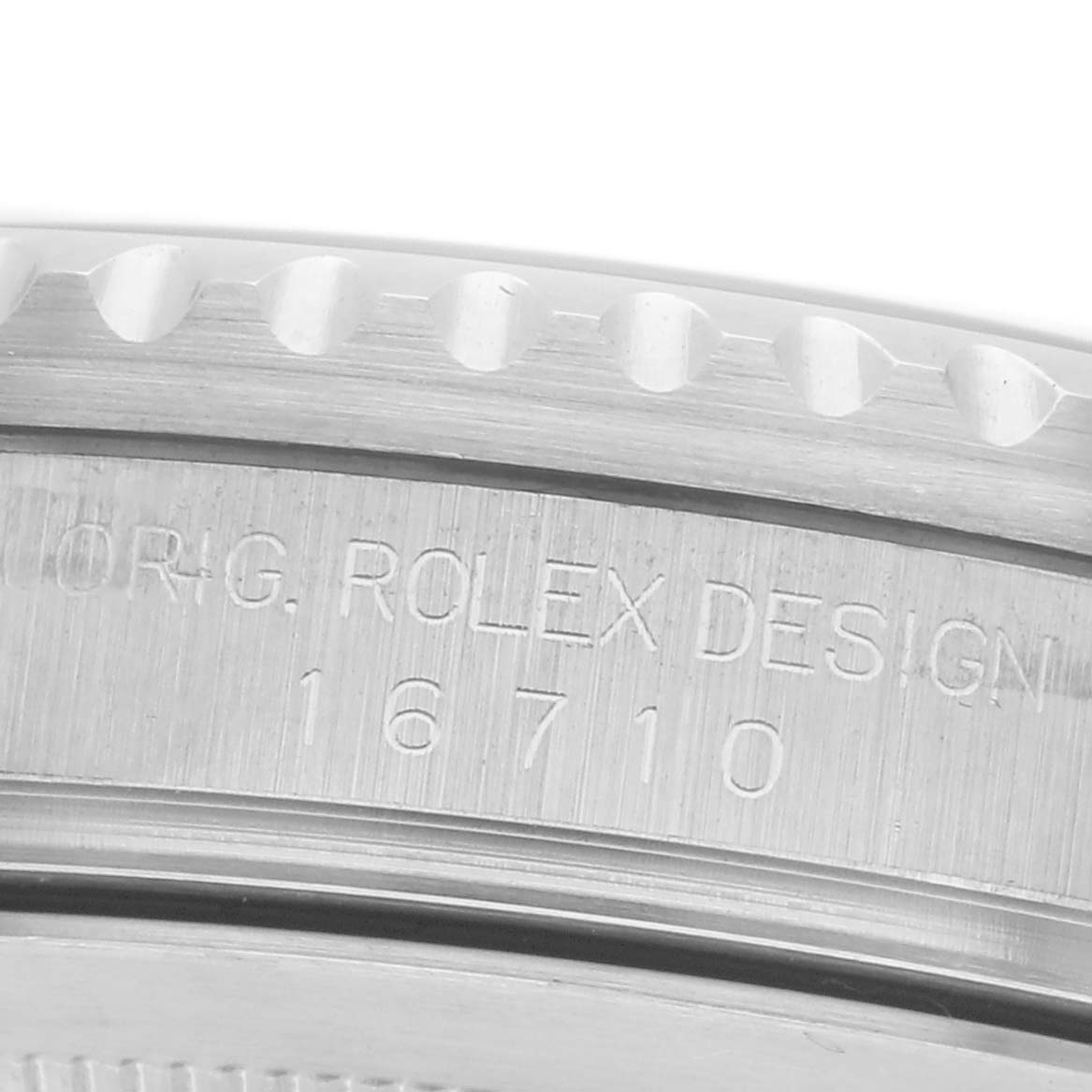 The image shows a close-up of the side of a Rolex GMT-Master 16710 Men
s Stainless Steel Black Dial 16710 Men
s Stainless Steel Black Dial, focusing on the engraved model number.