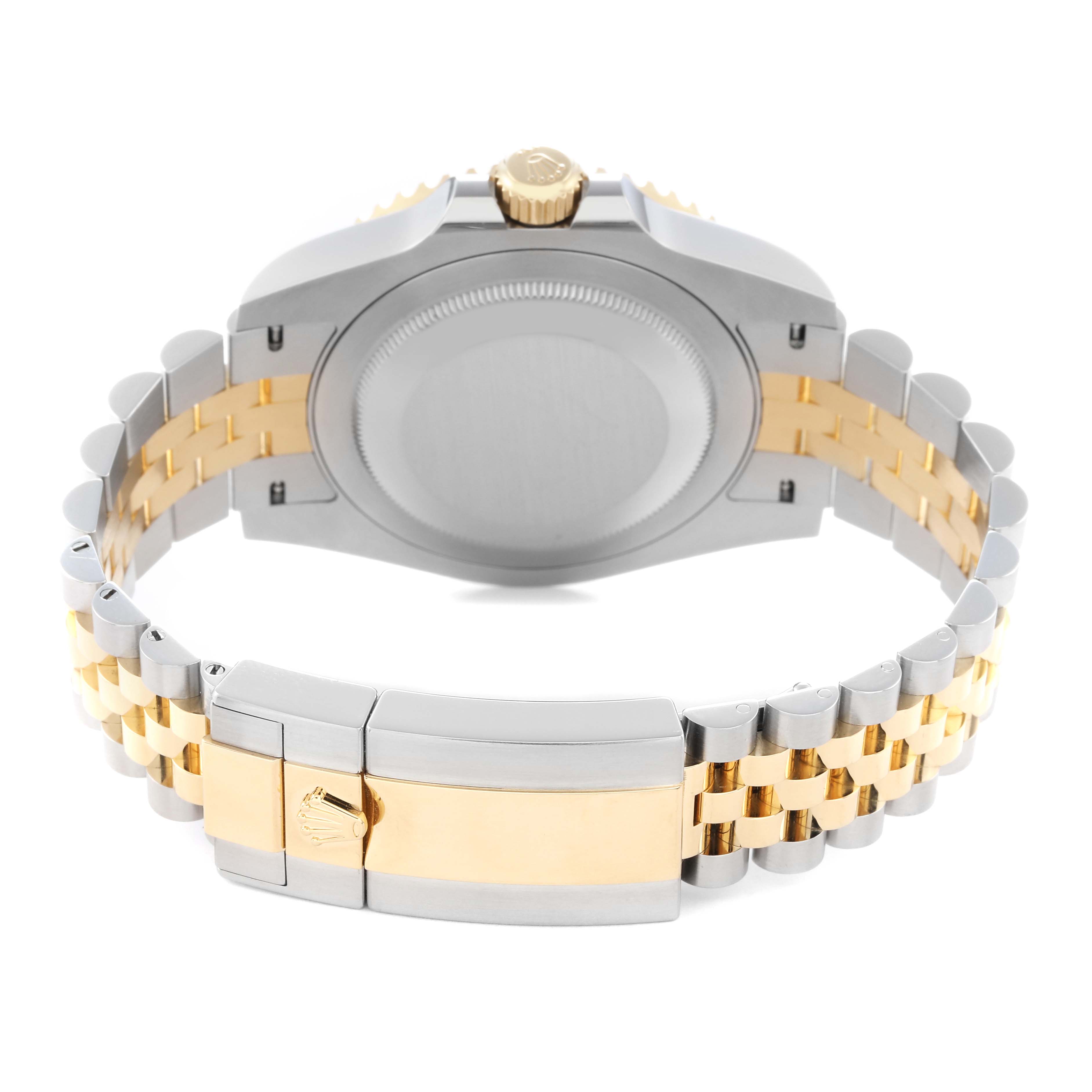 The image shows the backside of a Rolex GMT-Master 126713GRNR Men
s Steel and Gold (two tone) Black Dial 126713GRNR Men
s Steel and Gold (two tone) Black Dial watch, focusing on the case back and two-tone bracelet clasp.