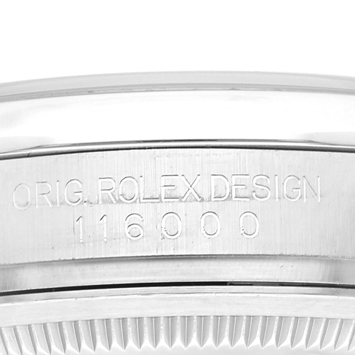 This image shows an up-close view of the side of the case and bezel of a Rolex Oyster Perpetual 116000 Men
s Stainless Steel Grey Dial 116000 Men
s Stainless Steel Grey Dial watch, displaying its design engraving.