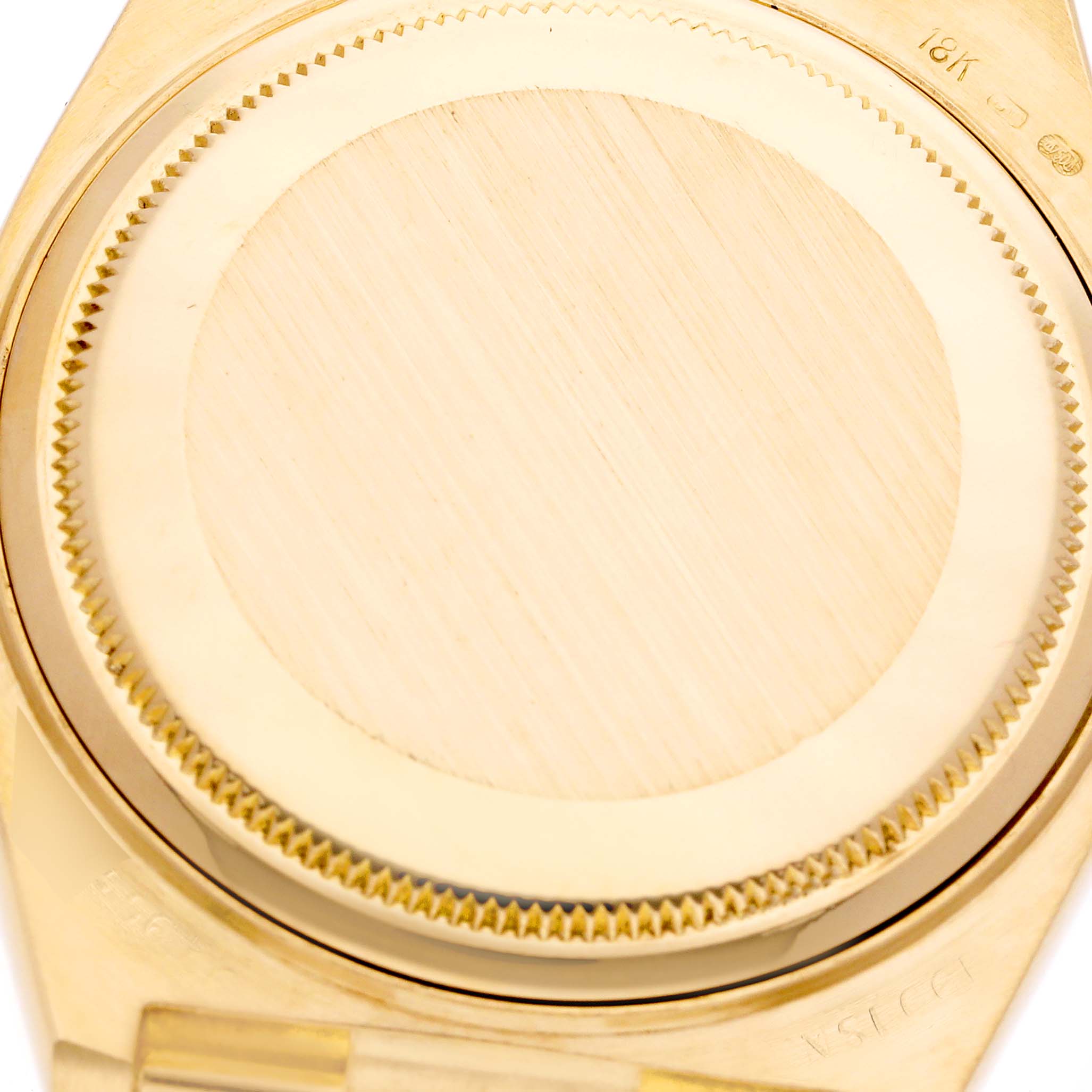This image shows a close-up of the case back of a Rolex Oysterquartz 19018 Men's Yellow Gold Champagne Dial 19018 Men's Yellow Gold Champagne Dial watch model, with visible brushed and polished gold finish.