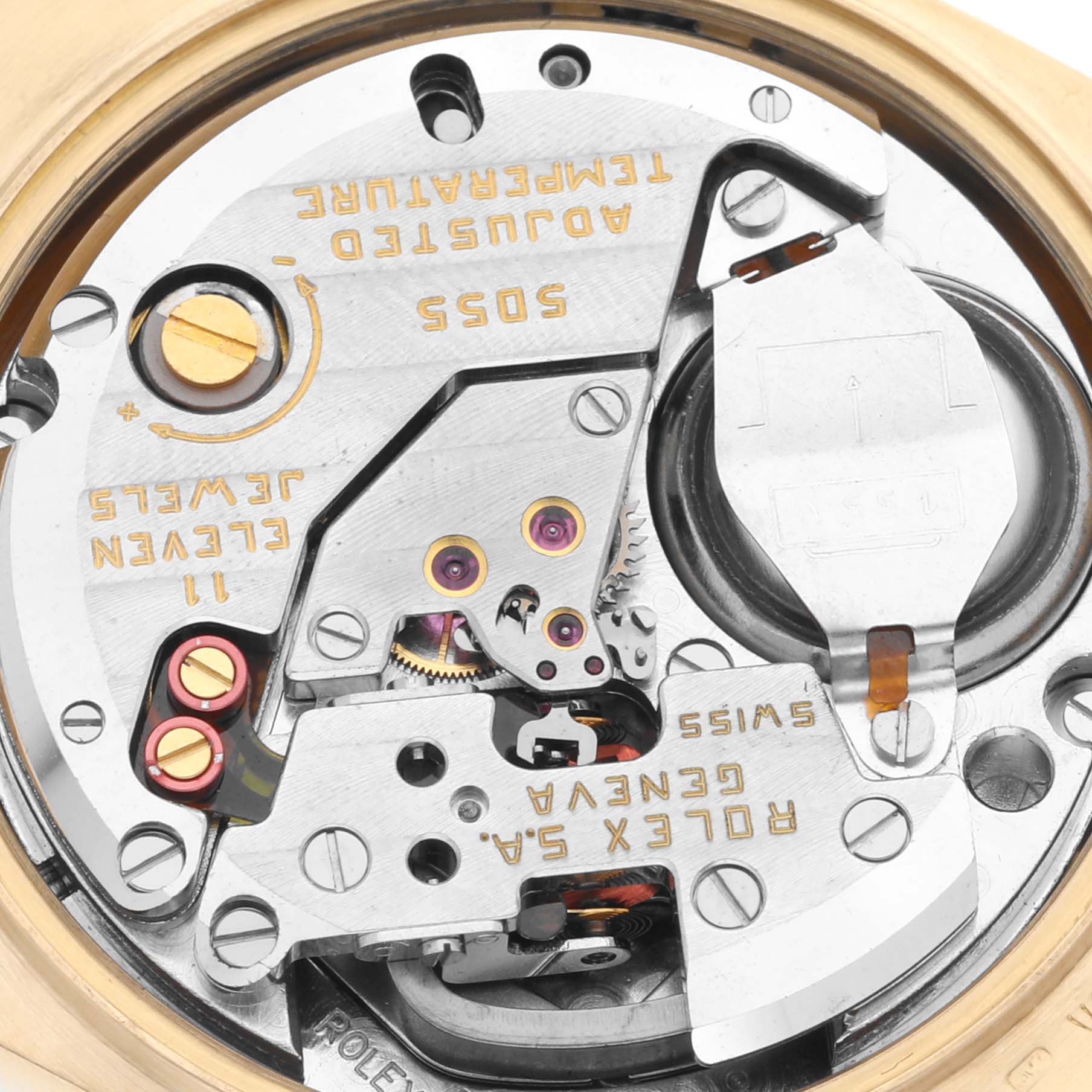 This image shows a close-up of the internal mechanical movement of a Rolex Oysterquartz 19018 Men's Yellow Gold Champagne Dial 19018 Men's Yellow Gold Champagne Dial watch, highlighting various gears and components.