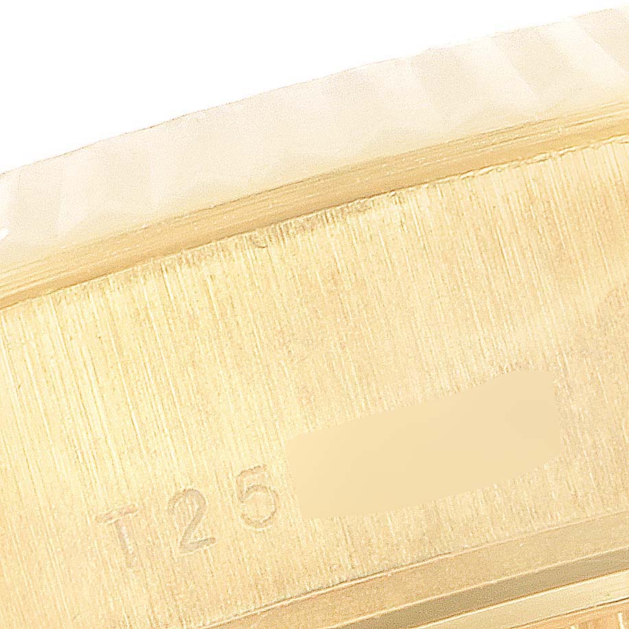 The image shows a close-up angle of the side of a Rolex President 69178 Women
s Yellow Gold Champagne Dial 69178 Women
s Yellow Gold Champagne Dial watch case, highlighting engraved markings.