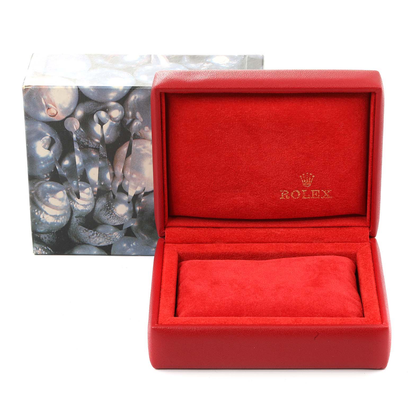 The image shows a red interior Rolex watch box for the President model, with the Rolex logo visible inside the lid.