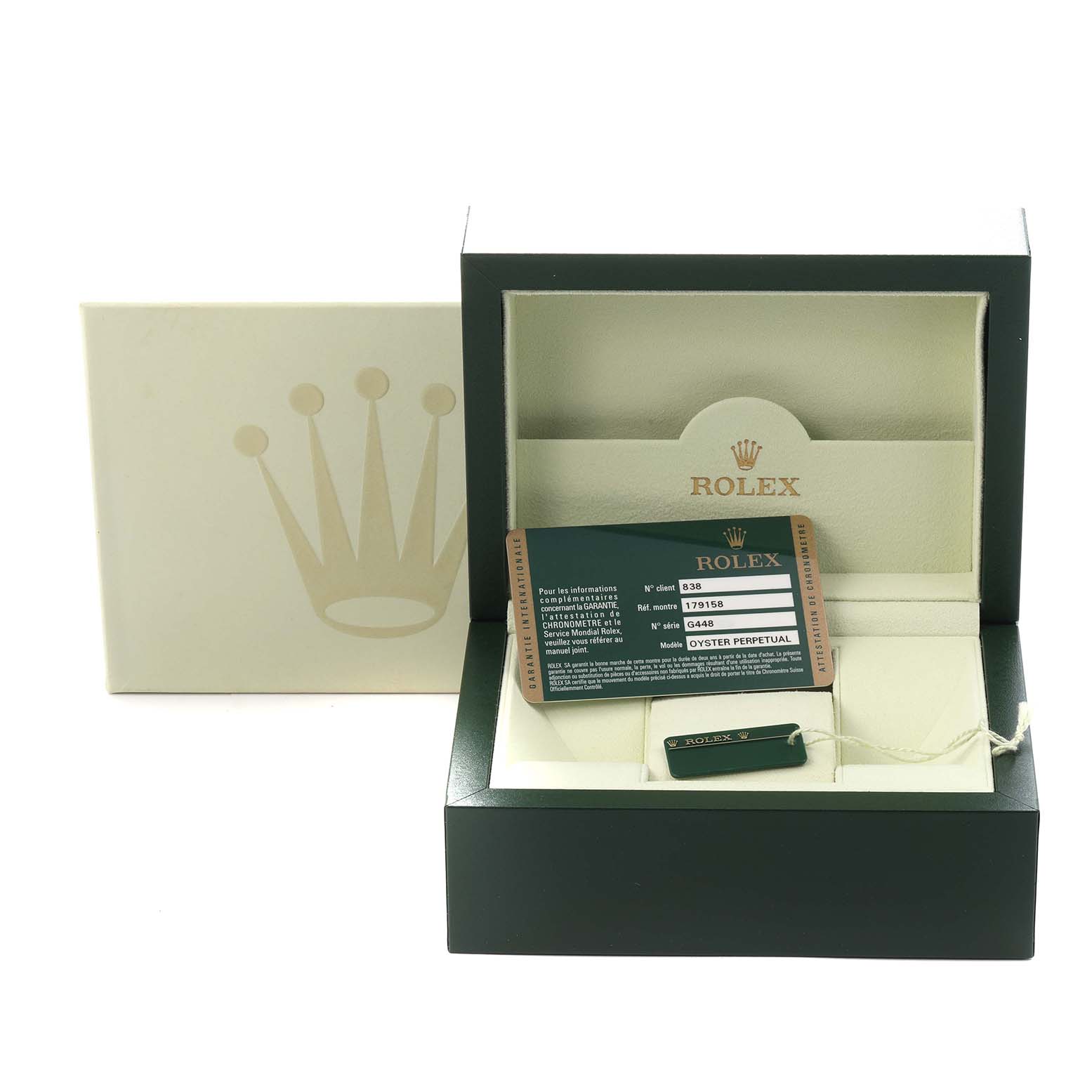 The image shows the packaging and accessories of a Rolex President 179158 Women's Yellow Gold Champagne Dial 179158 Women's Yellow Gold Champagne Dial model, including a box, card, and tag.