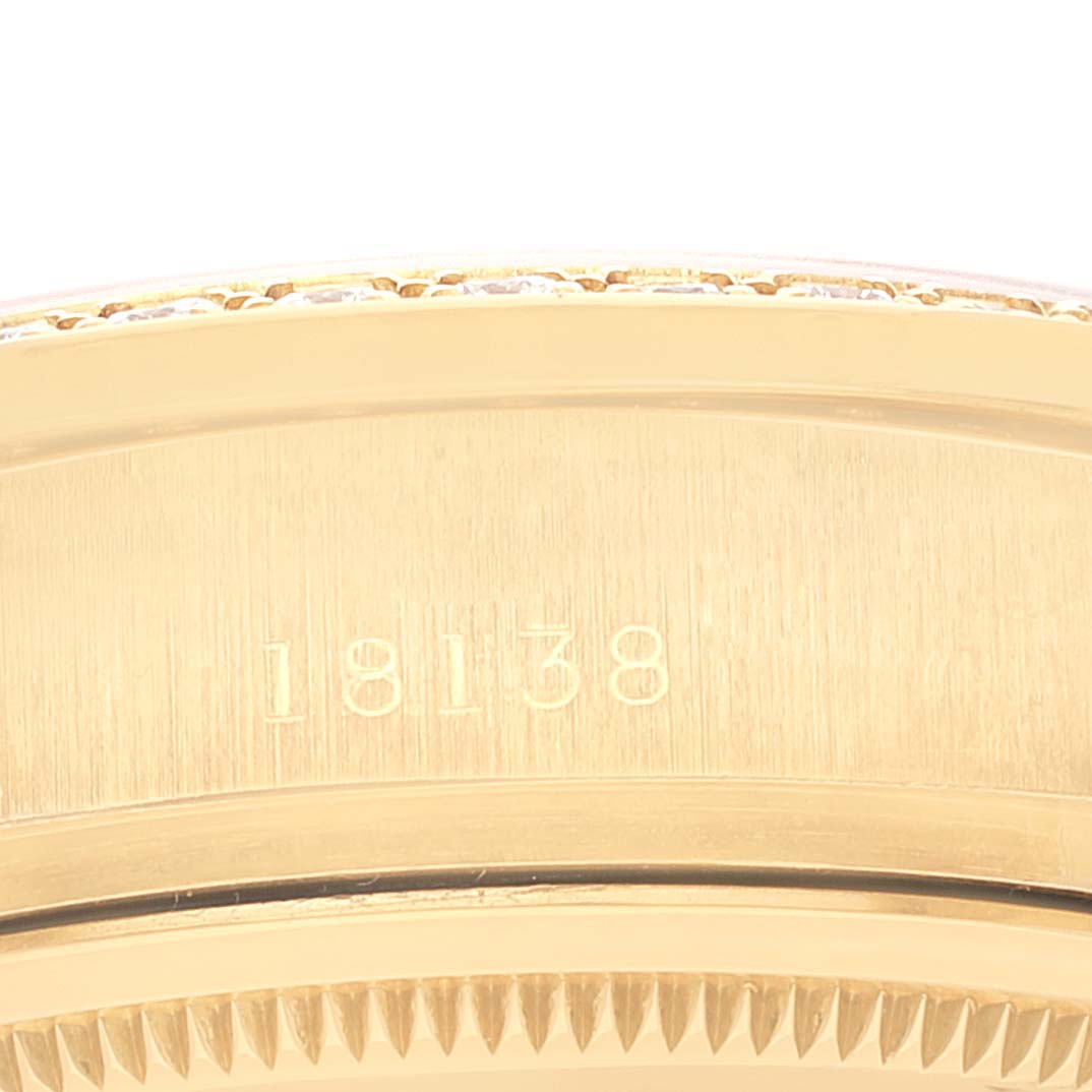 The image shows a close-up of the Rolex President 18138 Men
s Yellow Gold Champagne Dial 18138 Men
s Yellow Gold Champagne Dial model watch, focusing on the gold case with the model number 18138 engraved.