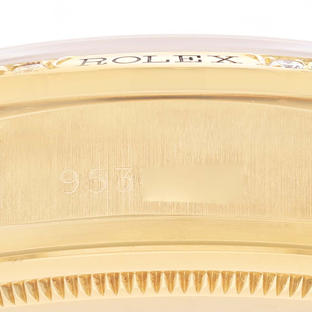 The image shows a close-up of the side of the case and the bezel of a Rolex President 18138 Men
s Yellow Gold Champagne Dial 18138 Men
s Yellow Gold Champagne Dial model watch with the brand name and partial serial number.