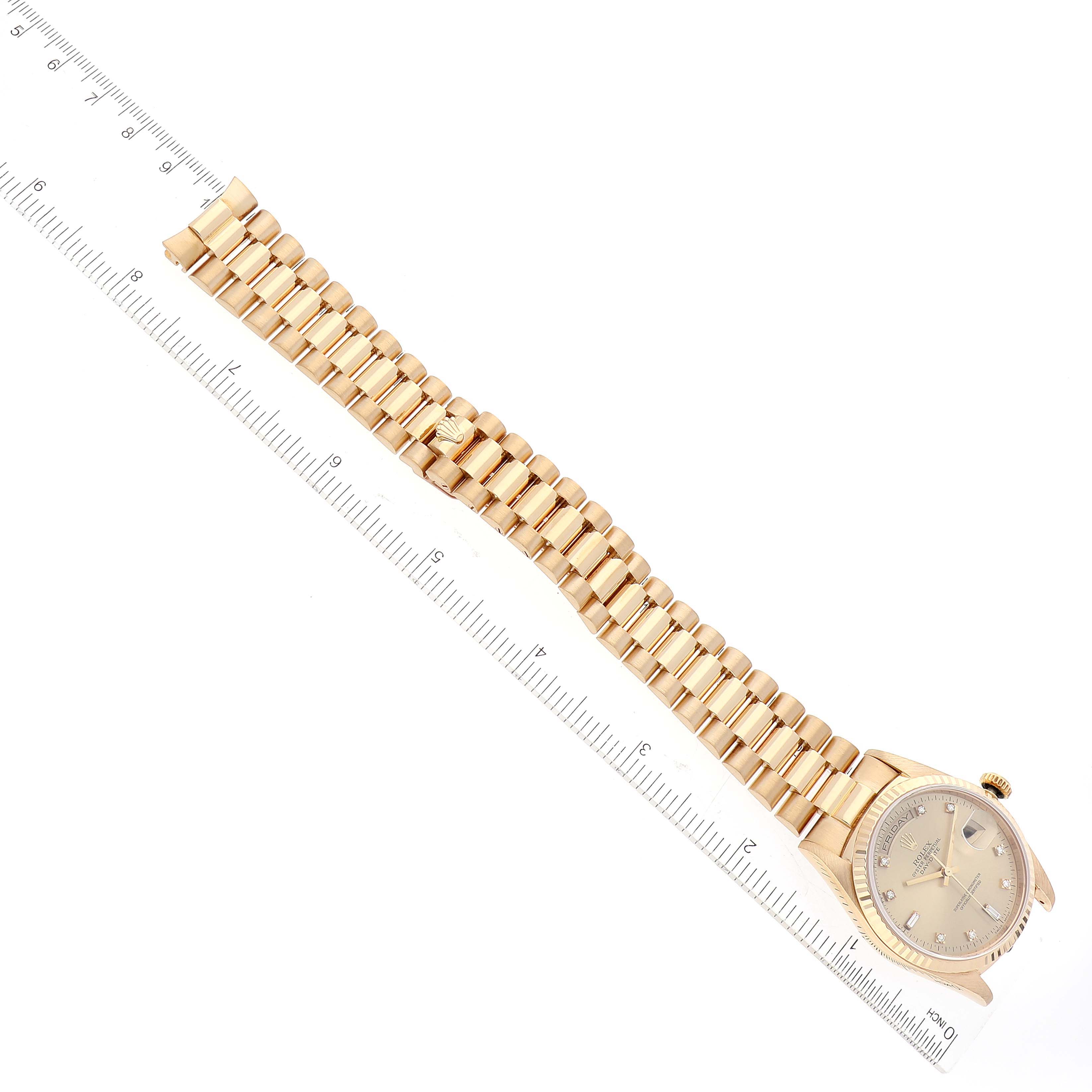 The image displays the Rolex President 18238 Men's Yellow Gold Champagne Dial 18238 Men's Yellow Gold Champagne Dial watch model laid flat with its bracelet extended and a ruler for scale.