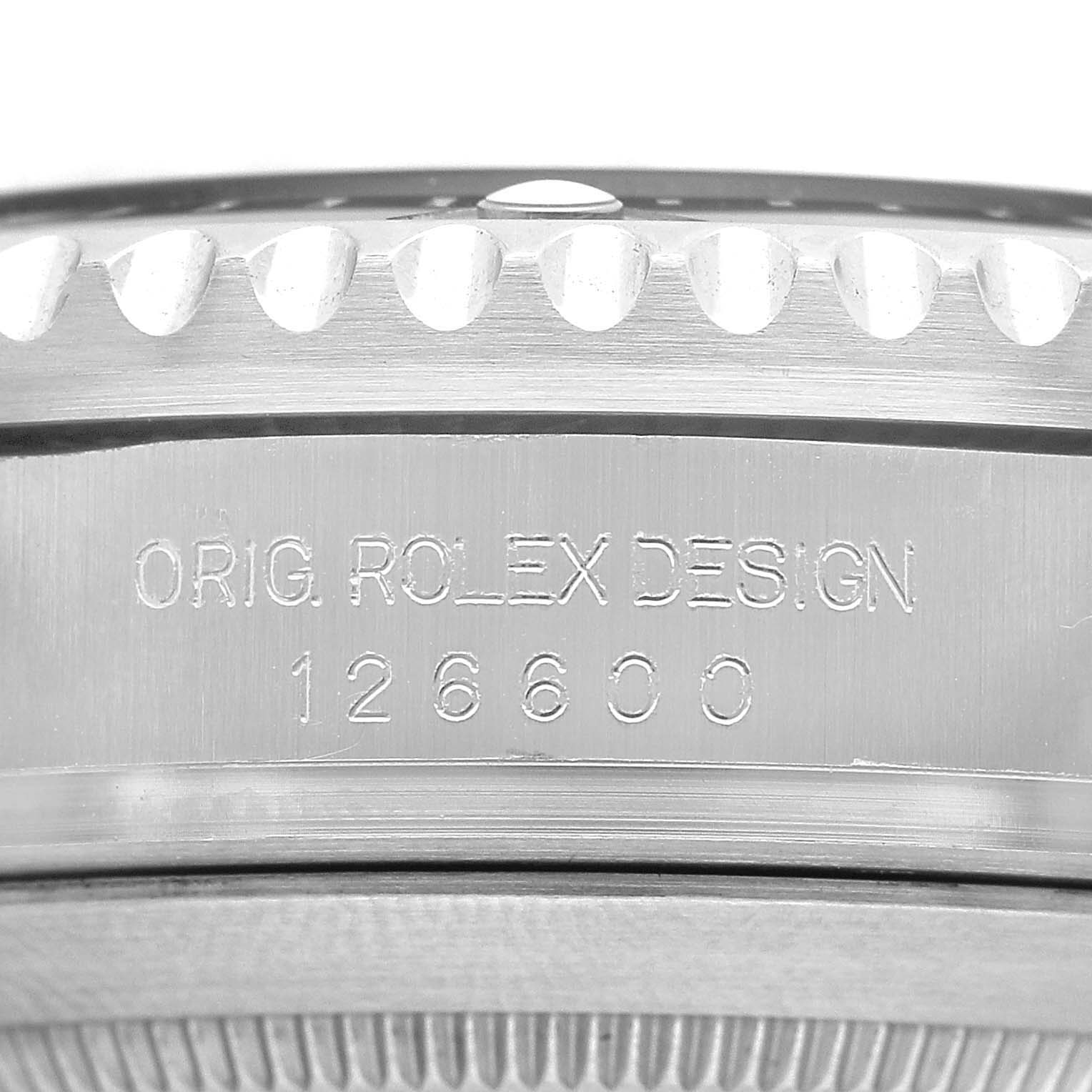 The image shows a close-up of the engraved side of a Rolex Sea-Dweller 126600 Men's Stainless Steel Black Dial watch, focusing on the model number 126600.