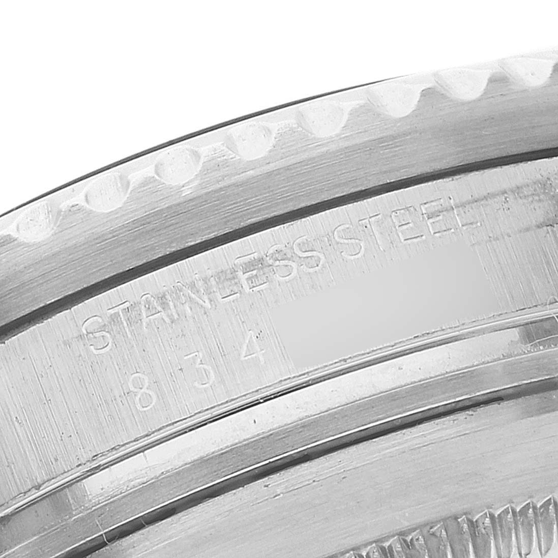 This close-up angle displays the engraving on the stainless steel back of a Rolex Sea-Dweller 16660 Men's Stainless Steel Black Dial 16660 Men's Stainless Steel Black Dial watch.