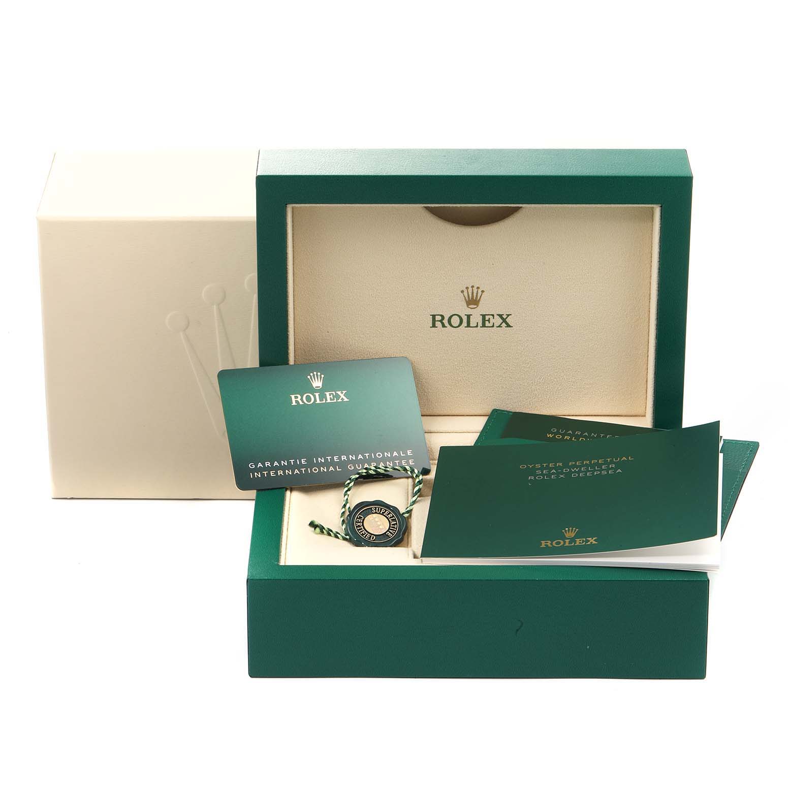 The image shows the packaging, international guarantee card, and booklets for the Rolex Sea-Dweller 126660 Men
s Stainless Steel Blue Dial 126660 Men
s Stainless Steel Blue Dial watch.