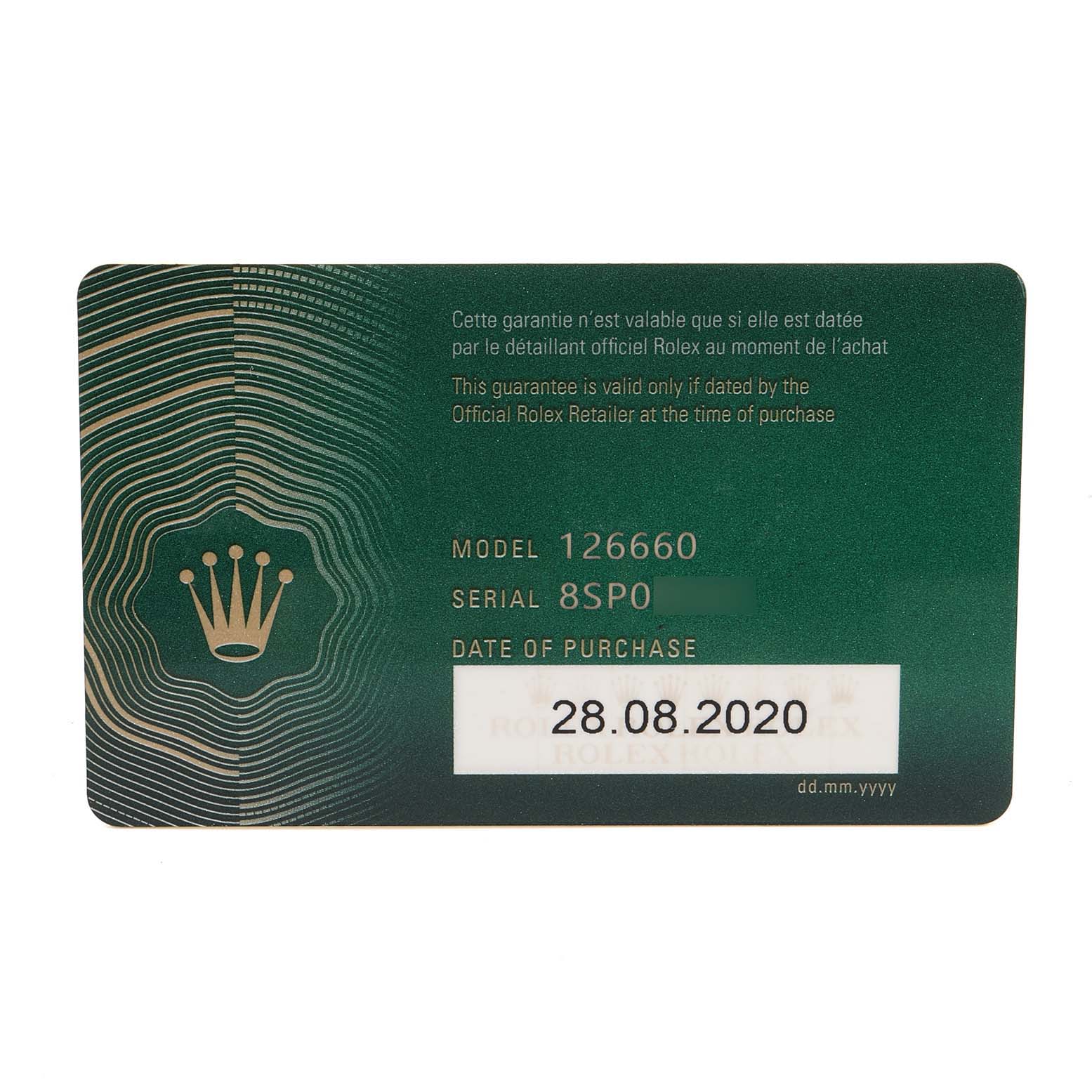 This image shows the warranty card for a Rolex Sea-Dweller 126660 Men
s Stainless Steel Blue Dial 126660 Men
s Stainless Steel Blue Dial model 126660, with purchase date and serial number visible.