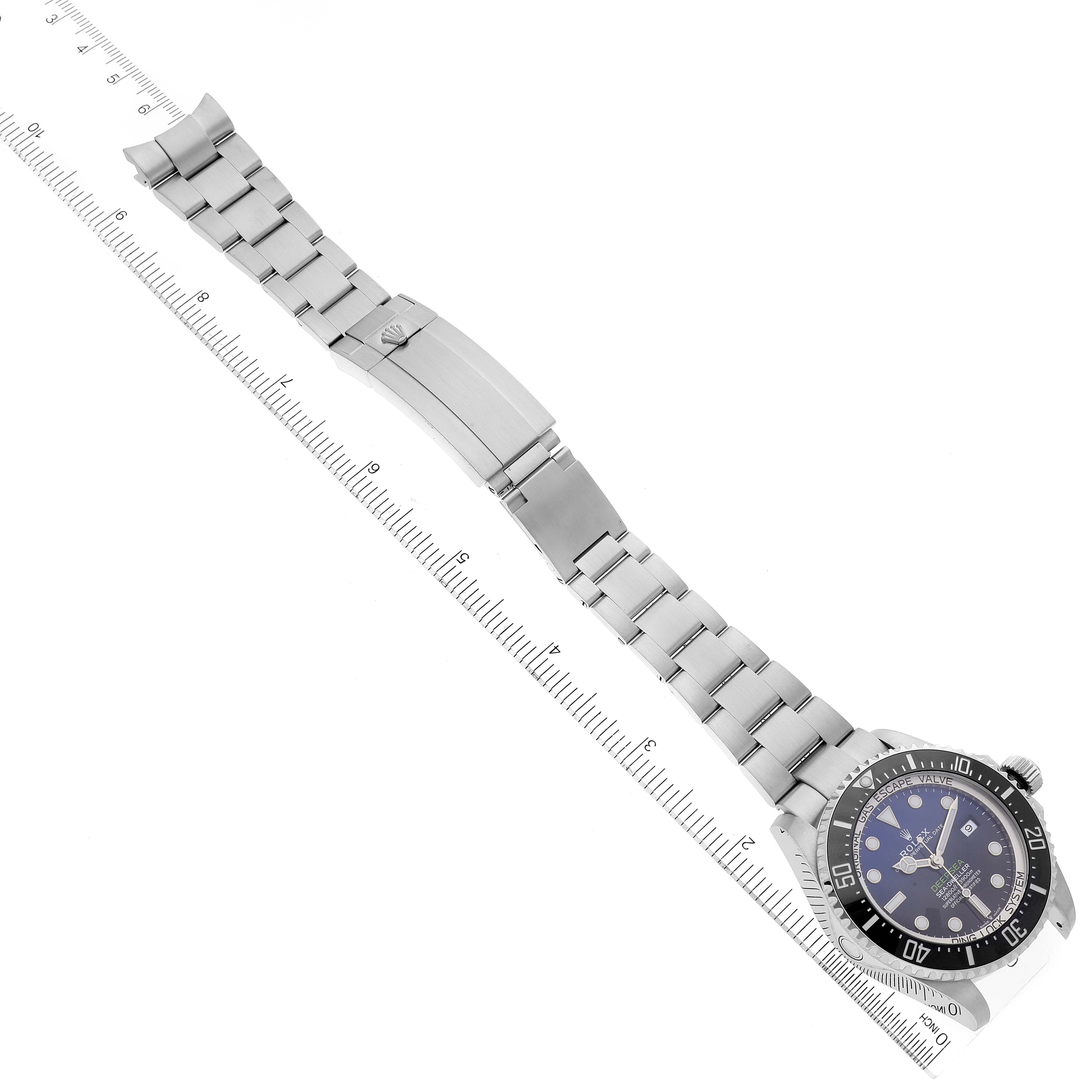The image displays a top-down view of a Rolex Sea-Dweller 126660 Men
s Stainless Steel Blue Dial 126660 Men
s Stainless Steel Blue Dial watch including its full bracelet, clasp, and dial.