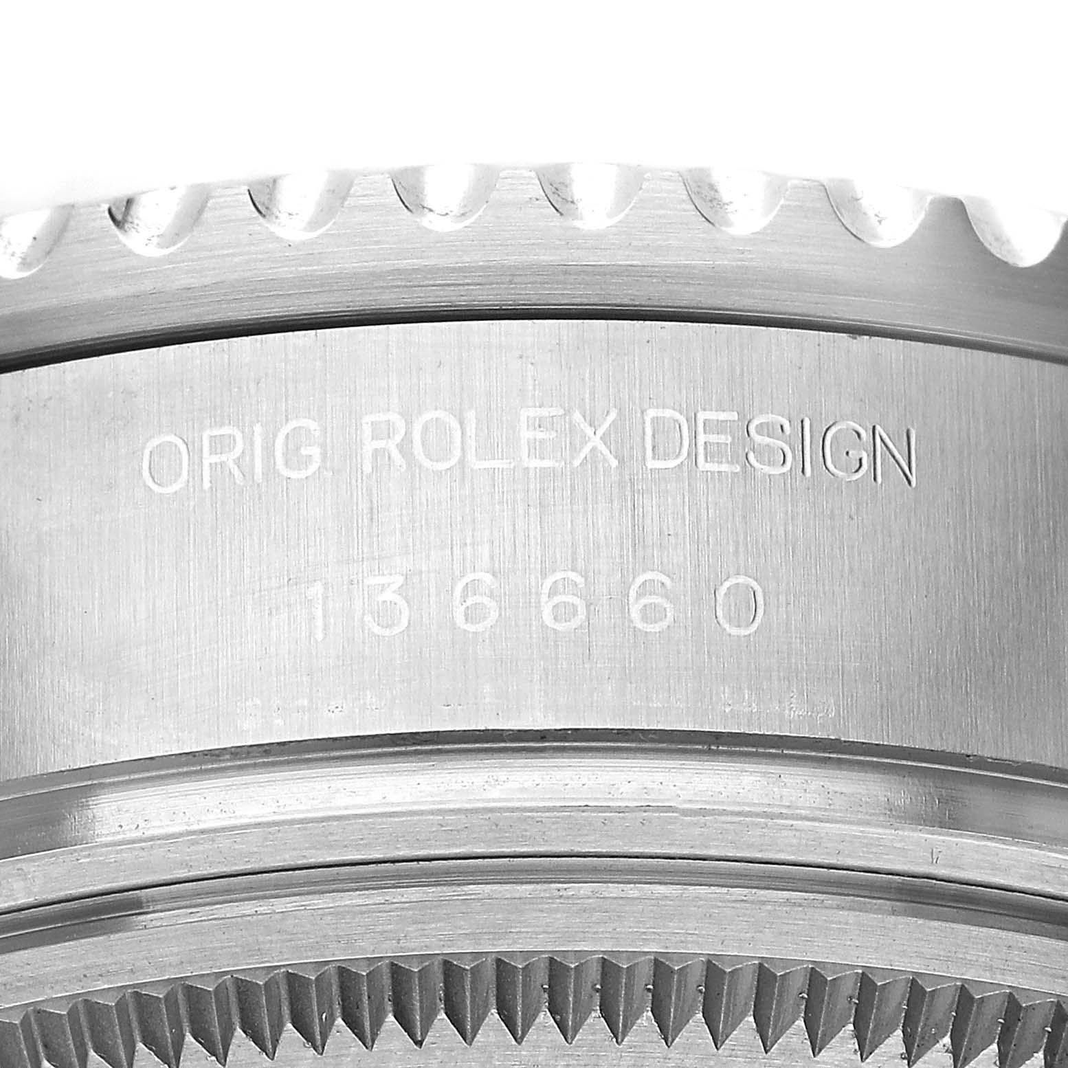 The image shows a close-up of the Rolex Sea-Dweller 126660 Men's Stainless Steel Blue Dial case side, highlighting the engraved model number and original design text.