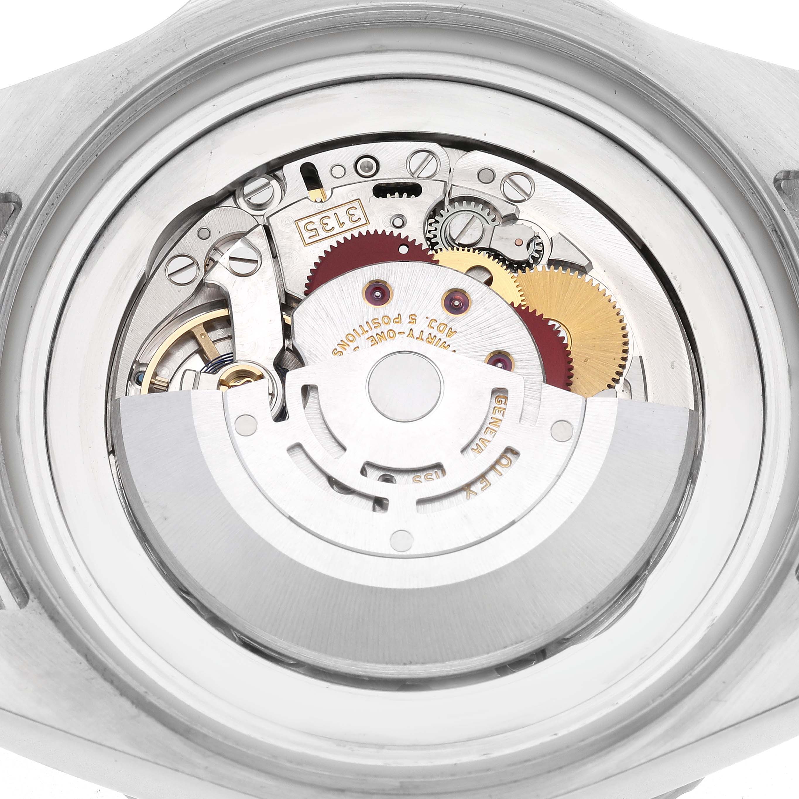 The image shows the back view of a Rolex Sea-Dweller 116660 Men
s Stainless Steel Black Dial 116660 Men
s Stainless Steel Black Dial, focusing on its mechanical movement and gears.