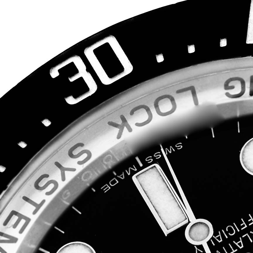 The image shows a close-up of the bezel and part of the dial of the Rolex Sea-Dweller 116660 Men
s Stainless Steel Black Dial 116660 Men
s Stainless Steel Black Dial, highlighting the 30-minute marker.