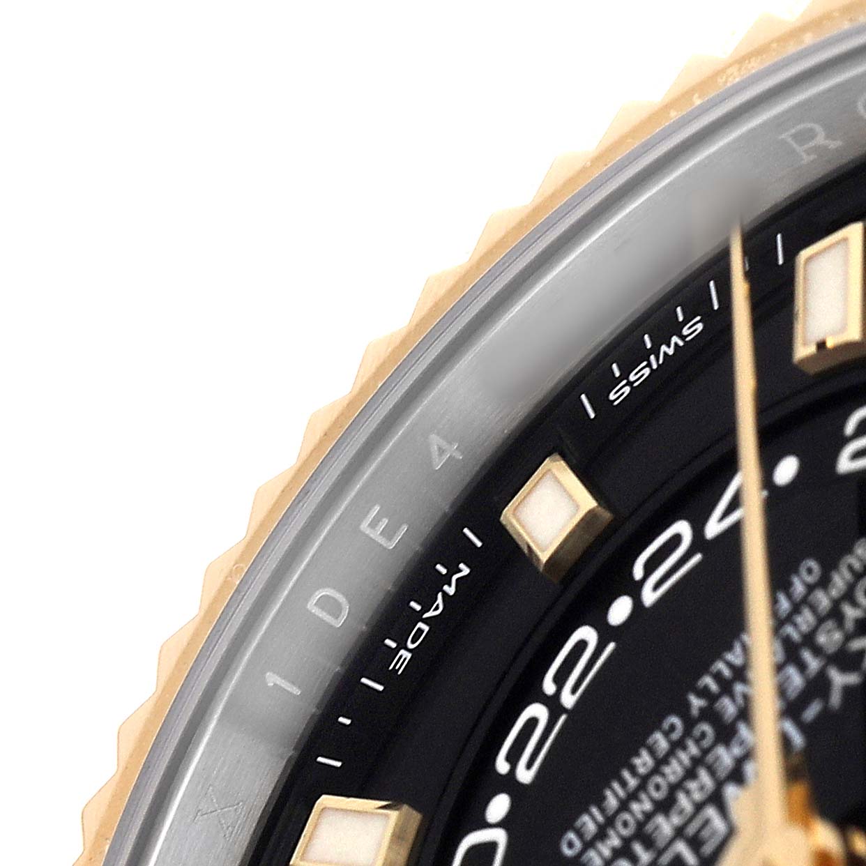 The image shows a close-up of the Rolex Sky-Dweller 326933 Men's Steel and Gold (two tone) Black Dial watch, focusing on the bezel, part of the dial, and hour markers.
