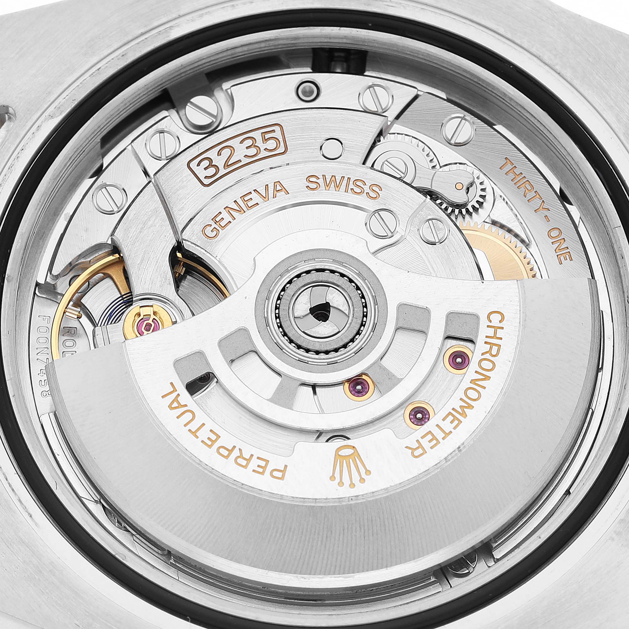 The image shows the intricate movement of a Rolex Submariner M126613LN-0002 Men's Steel and Gold (two tone) Black Dial watch, focusing on the rotor and gears from the back.