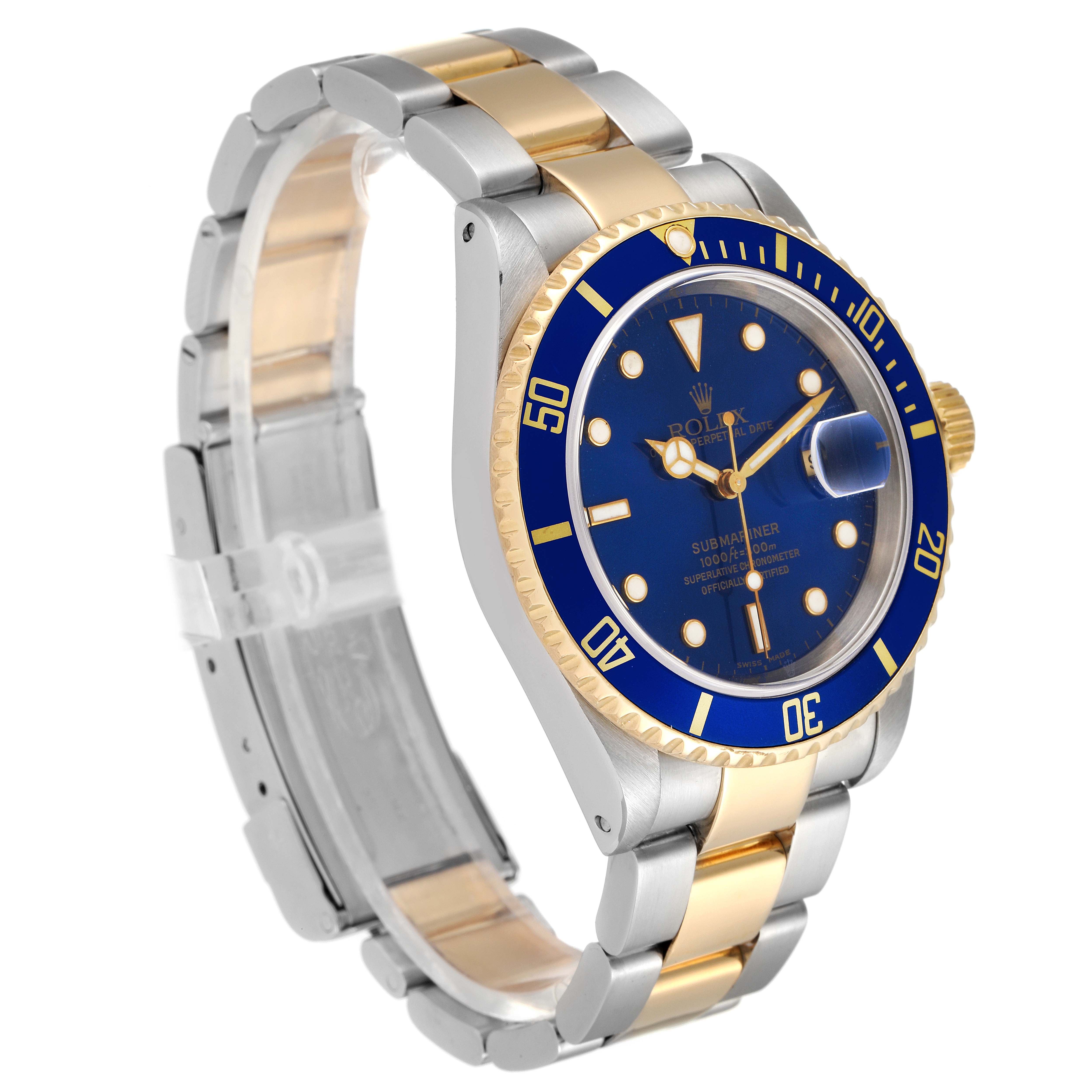 The image shows a Rolex Submariner 16613 Men's Steel and Gold (two tone) Blue Dial 16613 Men's Steel and Gold (two tone) Blue Dial watch at an angle displaying its blue dial, bezel, and two-tone metal band.