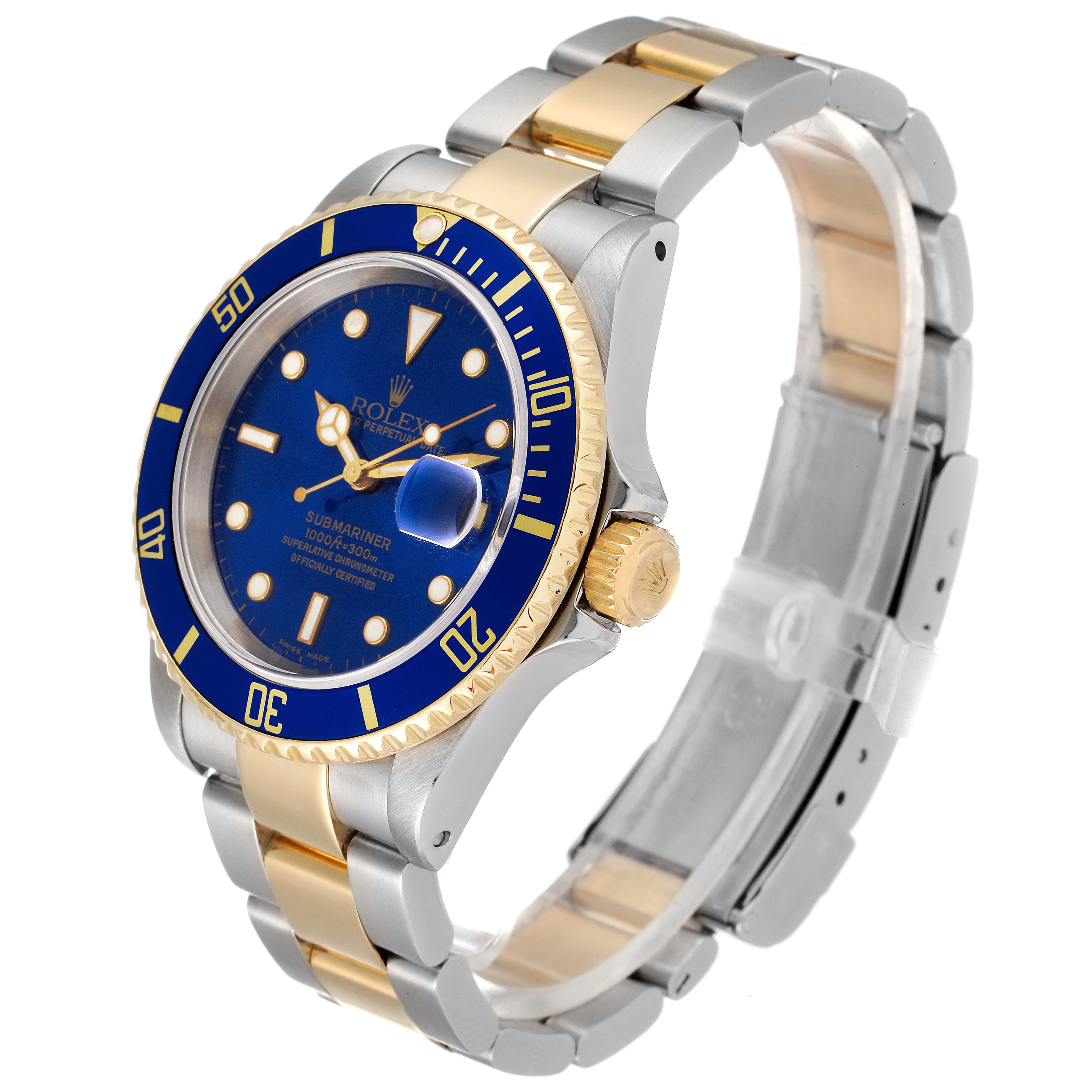The Rolex Submariner 16613 Men's Steel and Gold (two tone) Blue Dial 16613 Men's Steel and Gold (two tone) Blue Dial watch is shown at a 3/4 angle, displaying the blue bezel, dial, and two-tone bracelet.