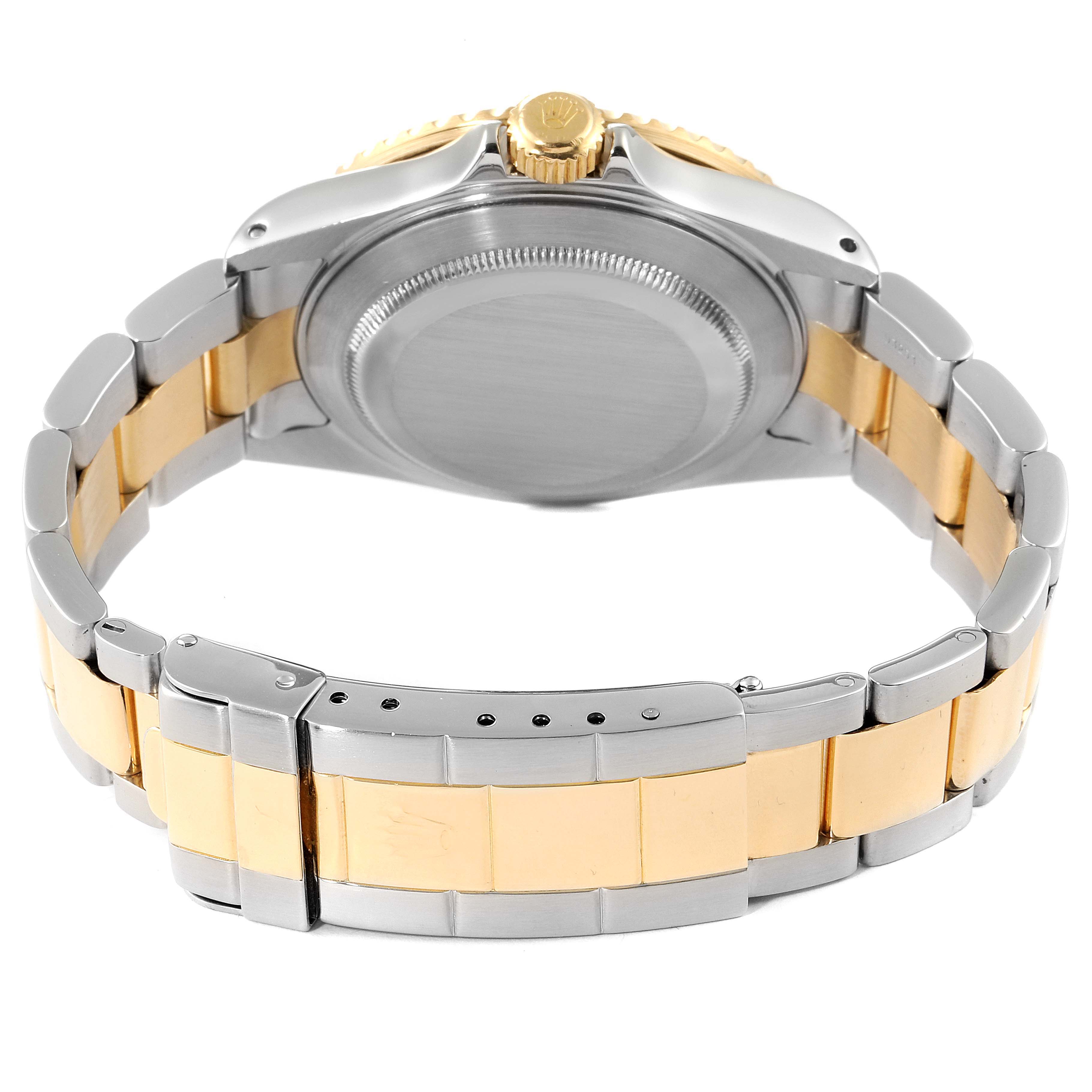 This image shows the case back and bracelet of a Rolex Submariner 16613 Men's Steel and Gold (two tone) Blue Dial 16613 Men's Steel and Gold (two tone) Blue Dial watch from a back angle.