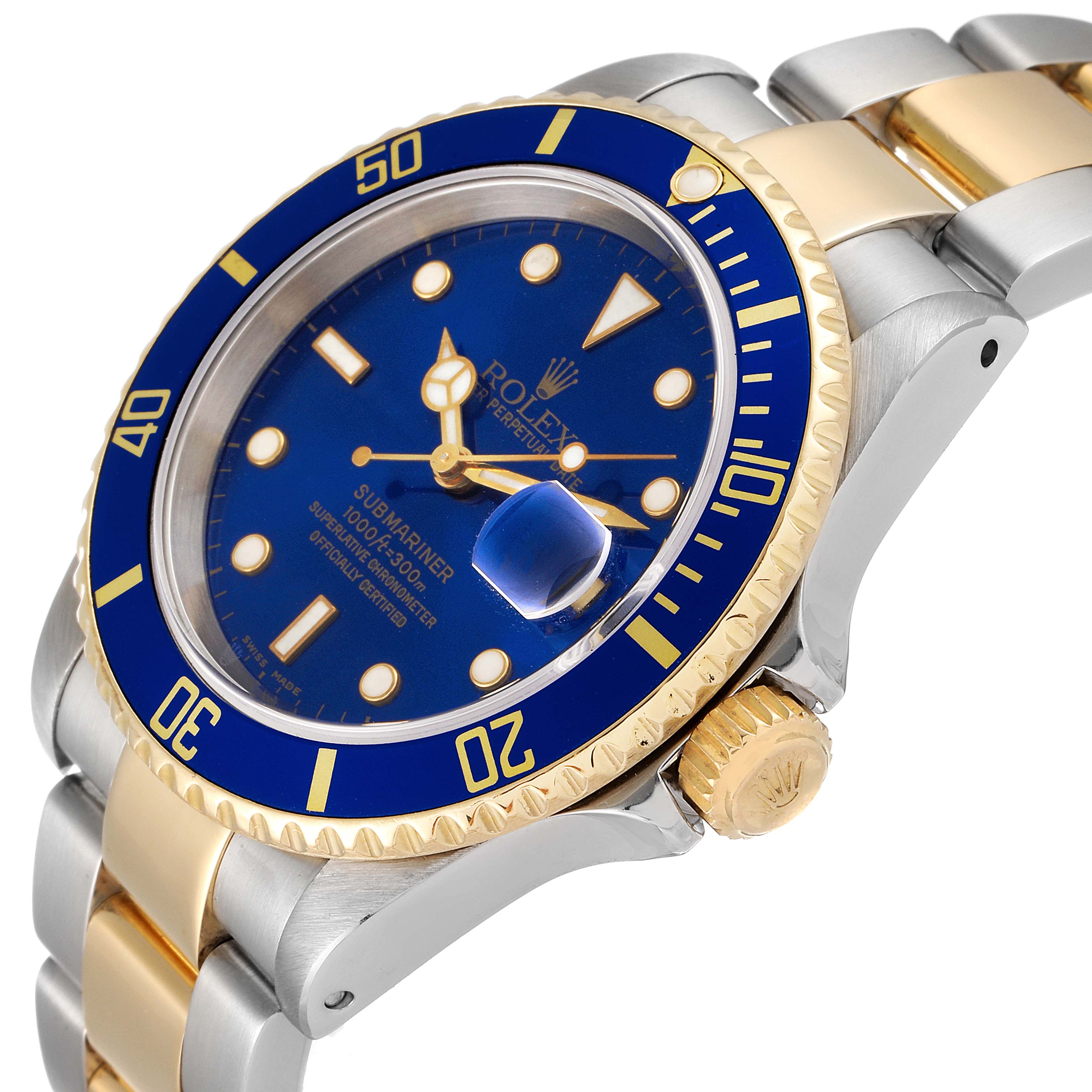 The image shows a Rolex Submariner 16613 Men's Steel and Gold (two tone) Blue Dial 16613 Men's Steel and Gold (two tone) Blue Dial watch at an angled view, highlighting the dial, bezel, crown, and two-tone bracelet.