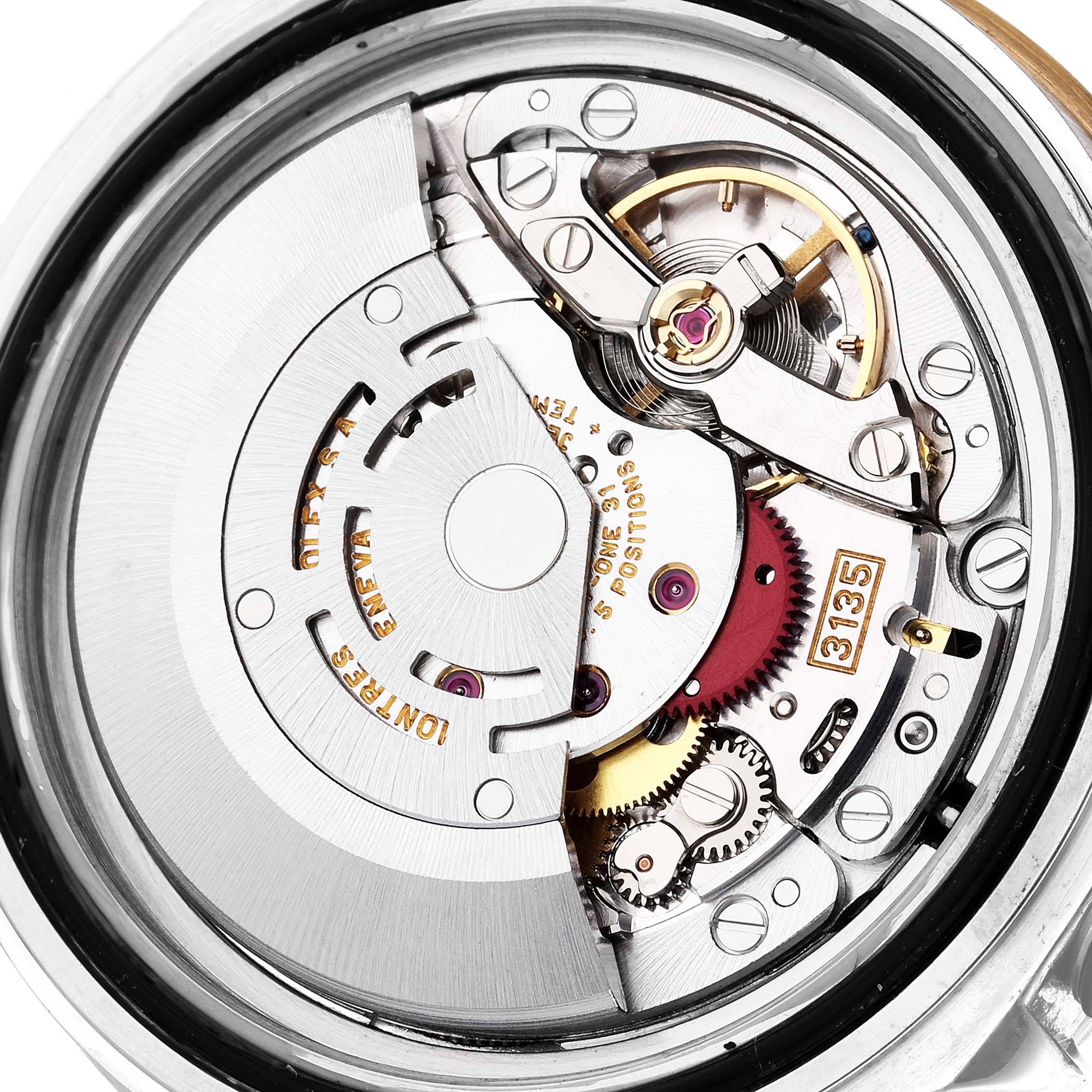 This image shows a close-up of the movement mechanism of a Rolex Submariner 16613 Men's Steel and Gold (two tone) Blue Dial 16613 Men's Steel and Gold (two tone) Blue Dial watch.