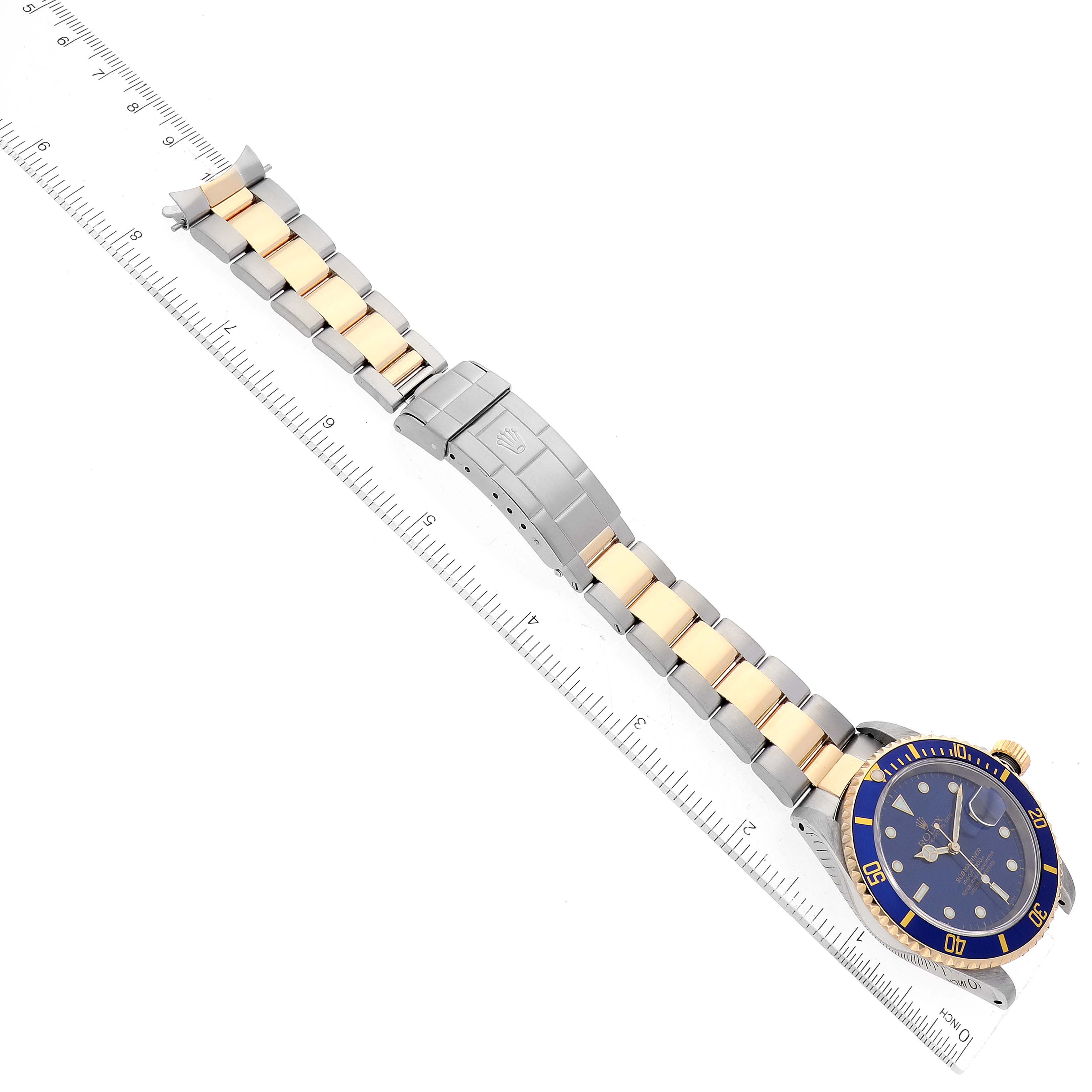 The image shows a flat, top-down view of a Rolex Submariner 16613 Men's Steel and Gold (two tone) Blue Dial 16613 Men's Steel and Gold (two tone) Blue Dial watch, emphasizing the band, clasp, and watch face.