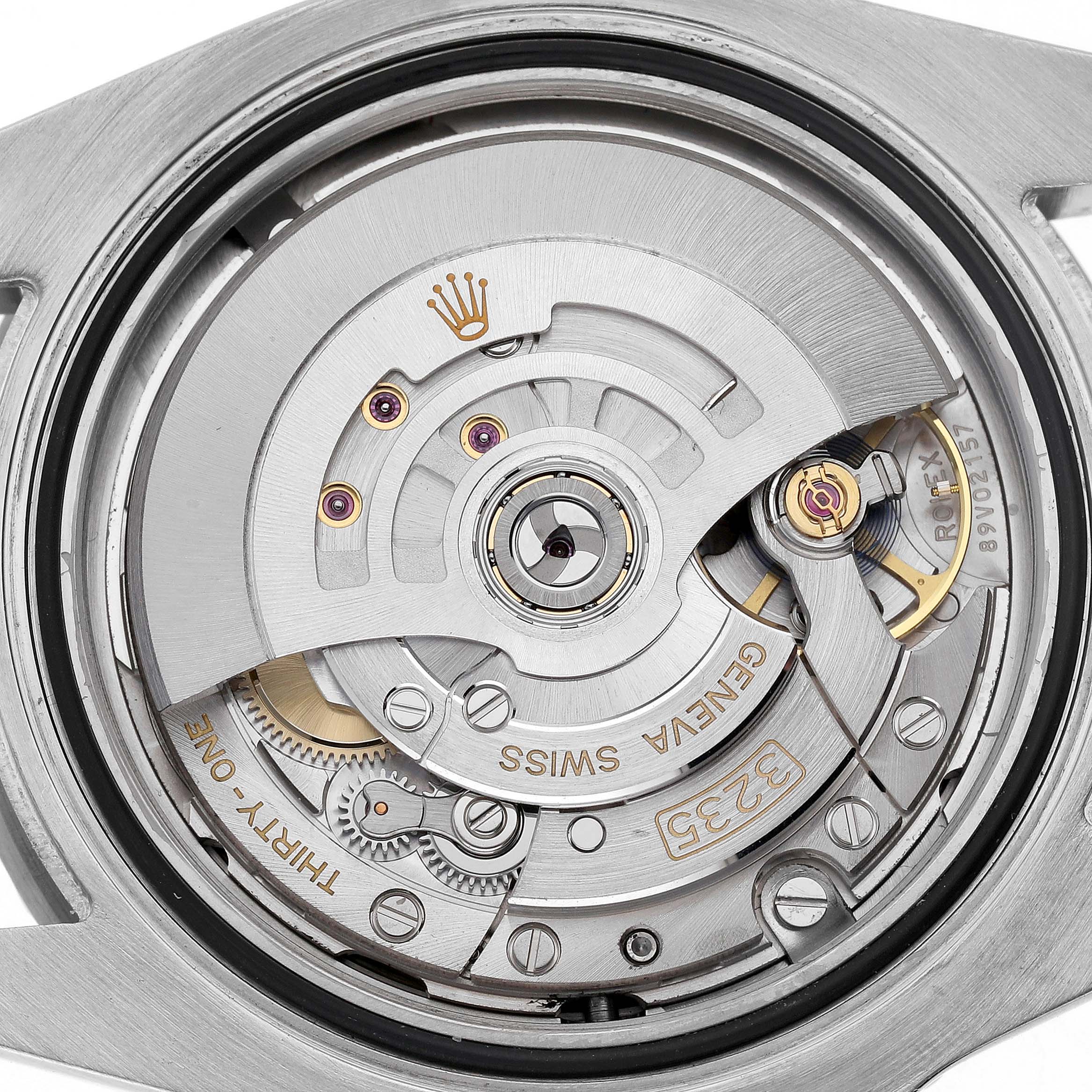 The image shows the movement of a Rolex Submariner 126610LN Men's Stainless Steel Black Dial, viewed from the back, highlighting its intricate mechanical parts.