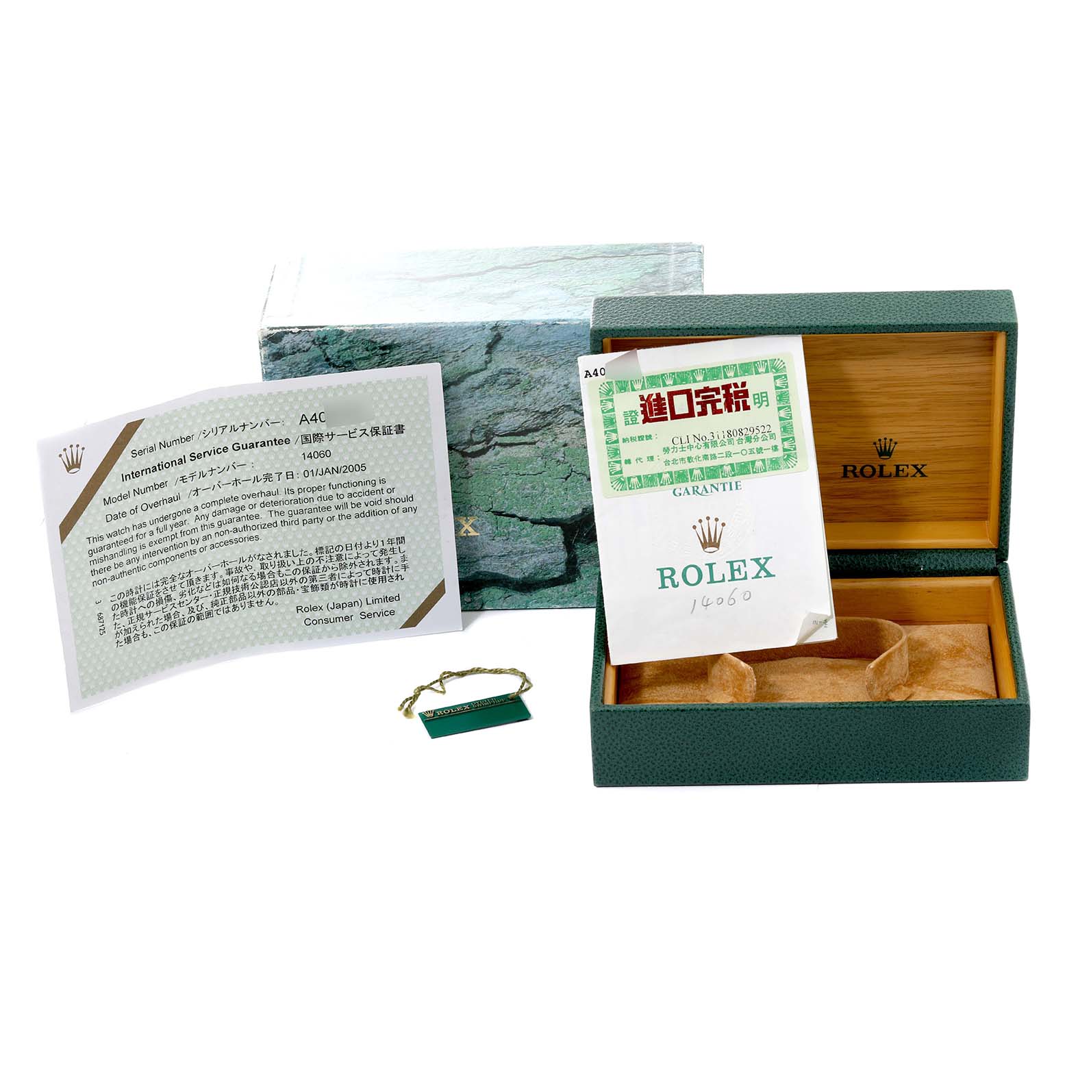 The image shows a Rolex Submariner 14060 Men
s Stainless Steel Black Dial 14060 Men
s Stainless Steel Black Dial model box set, including the original box, paperwork, and a tag.