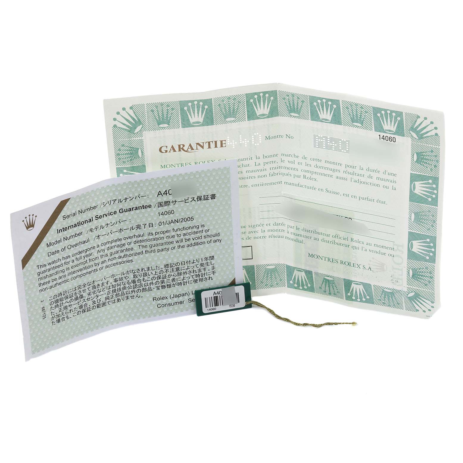 This image shows the warranty card and International Service Guarantee for a Rolex Submariner 14060 Men
s Stainless Steel Black Dial 14060 Men
s Stainless Steel Black Dial model, along with a green tag.
