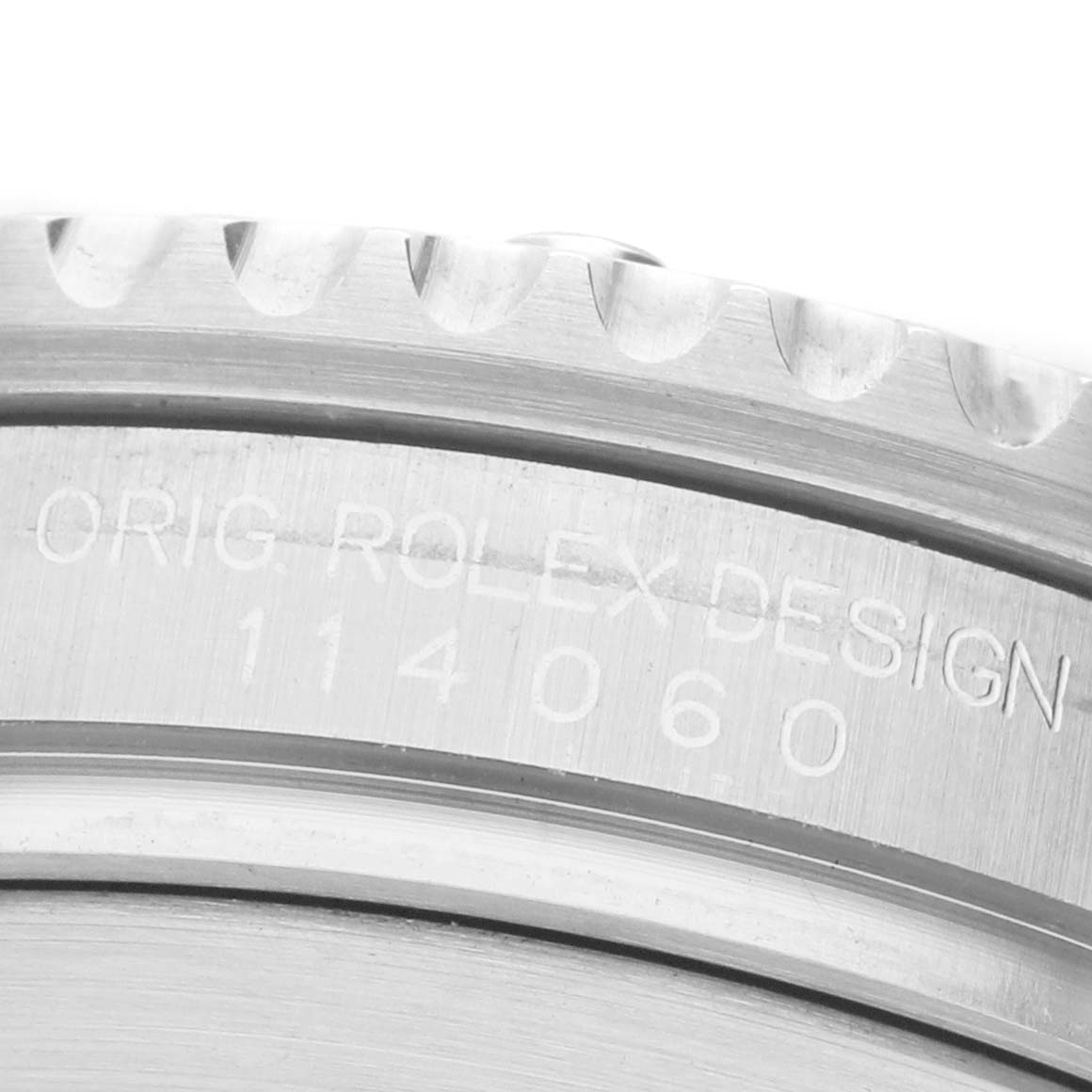 The image shows the side view of the Rolex Submariner 114060 Men's Stainless Steel Black Dial's case, highlighting the engraved model number 114060 and the bezel.