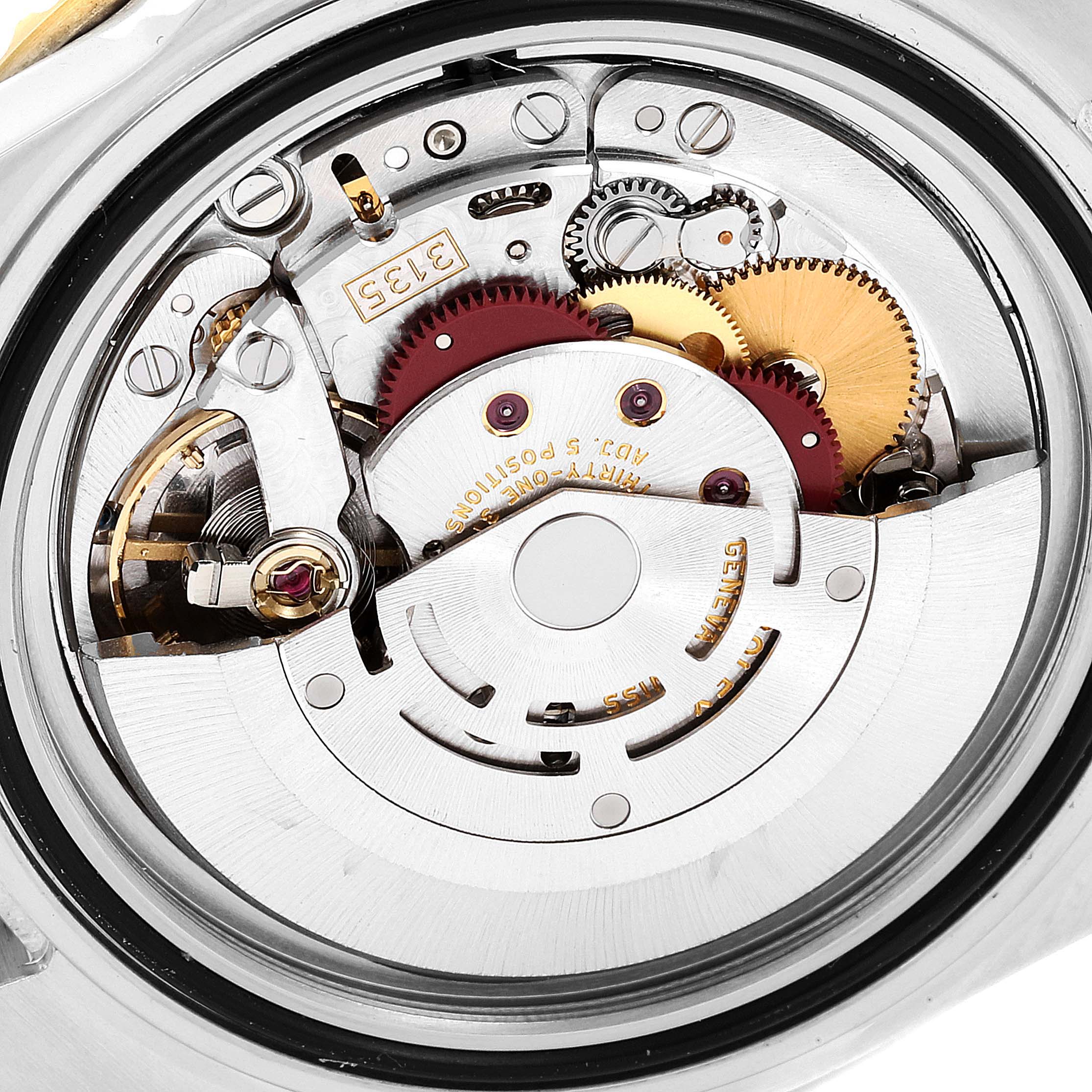 This image shows the inner mechanical movement of a Rolex Submariner 16613 Men
s Steel and Gold (two tone) Blue Dial 16613 Men
s Steel and Gold (two tone) Blue Dial watch from a close-up angle.