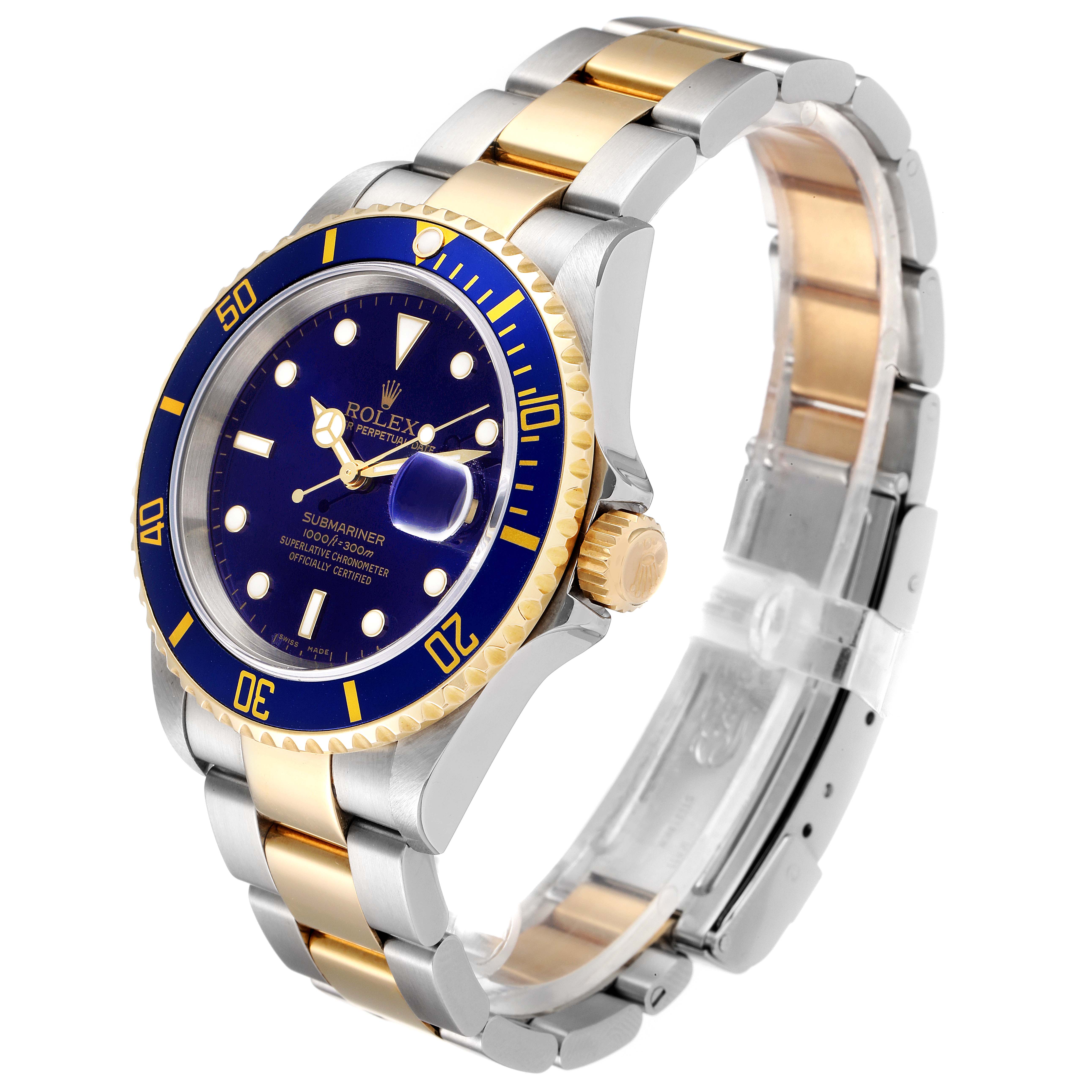 The image shows a Rolex Submariner 16613 Men
s Steel and Gold (two tone) Blue Dial 16613 Men
s Steel and Gold (two tone) Blue Dial watch at a slight angle, highlighting the face, bezel, crown, and two-tone bracelet.