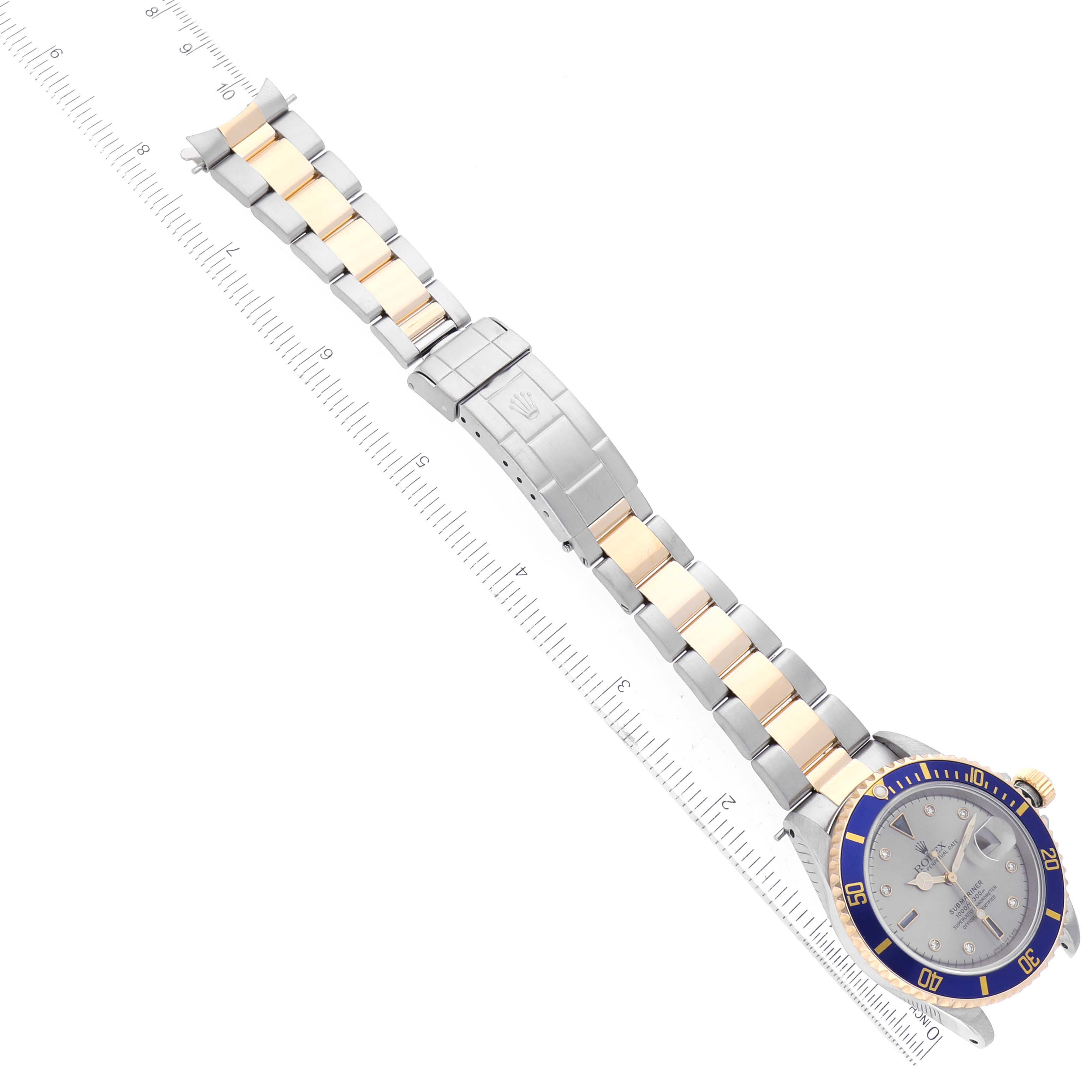 The image shows a top-down view of a Rolex Submariner 16613 Men's Steel and Gold (two tone) Silver Dial 16613 Men's Steel and Gold (two tone) Silver Dial watch, including its face, bezel, and two-tone metal bracelet.