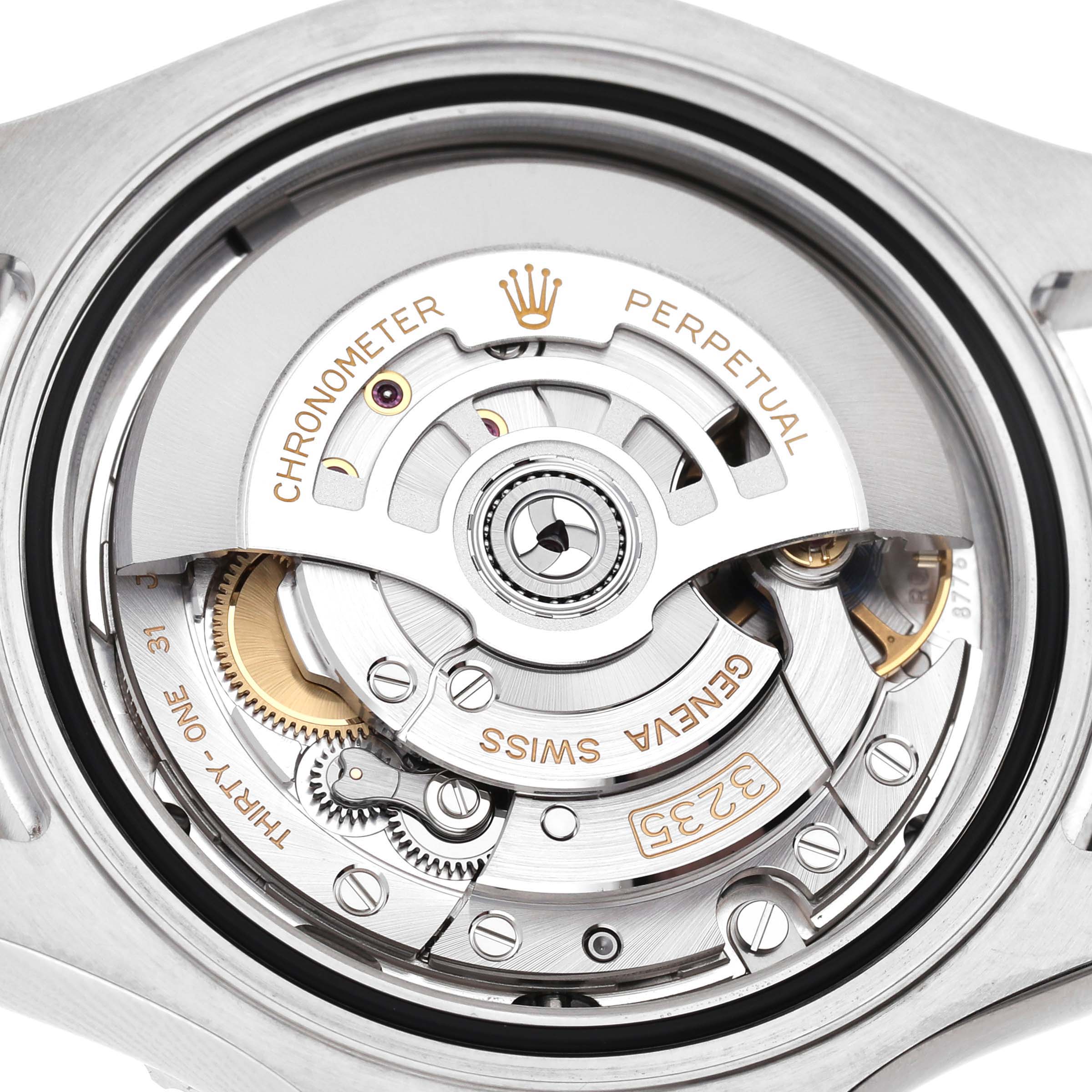 The image shows a close-up of the movement from the back of a Rolex Yacht-Master 126622 Men's Stainless Steel Blue Dial watch, highlighting gears and inscriptions.