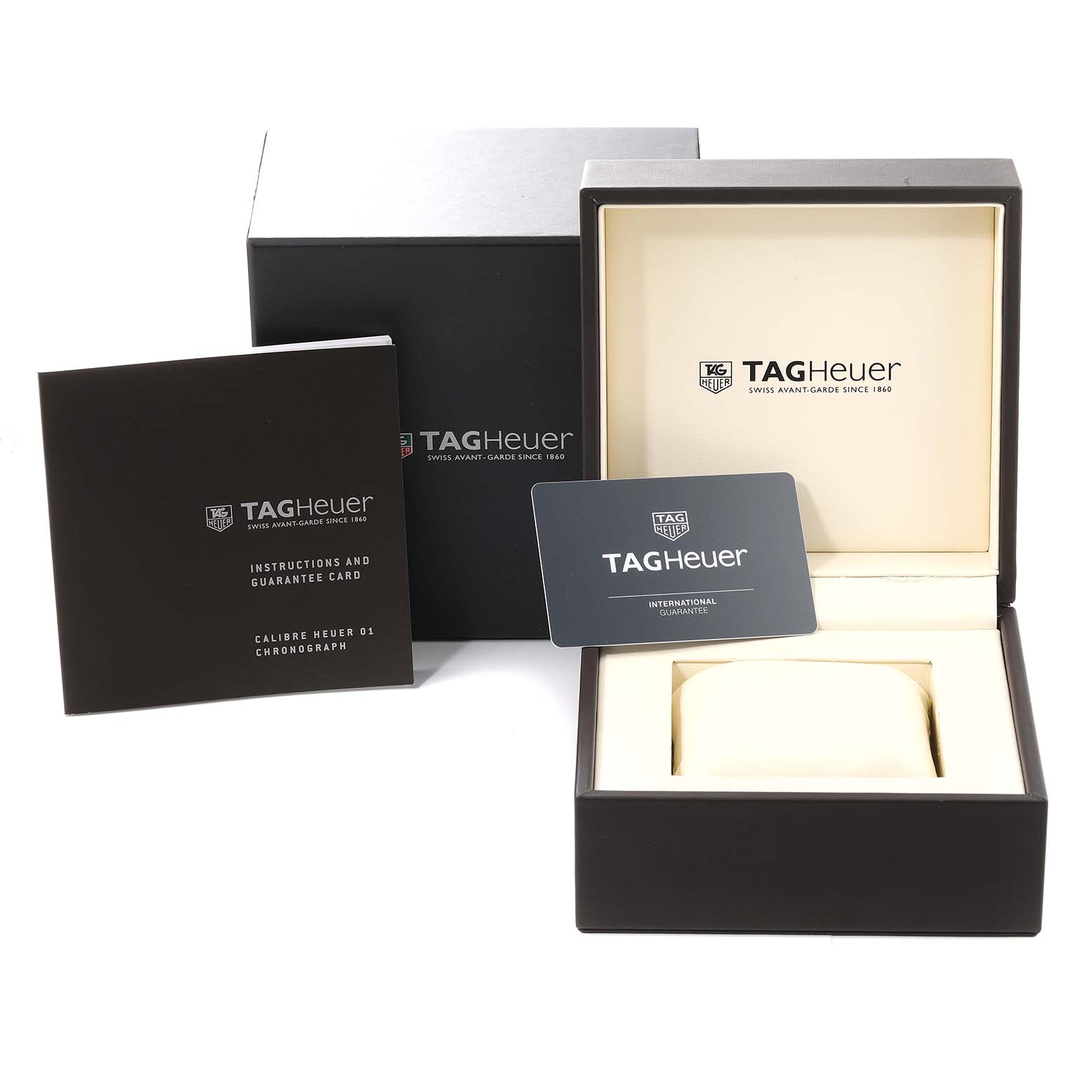 This image shows the packaging, instruction booklet, and guarantee card for the Tag Heuer Carrera CAR2A90.FT6071 Men's Ceramic Transparent Dial CAR2A90.FT6071 Men's Ceramic Transparent Dial watch.