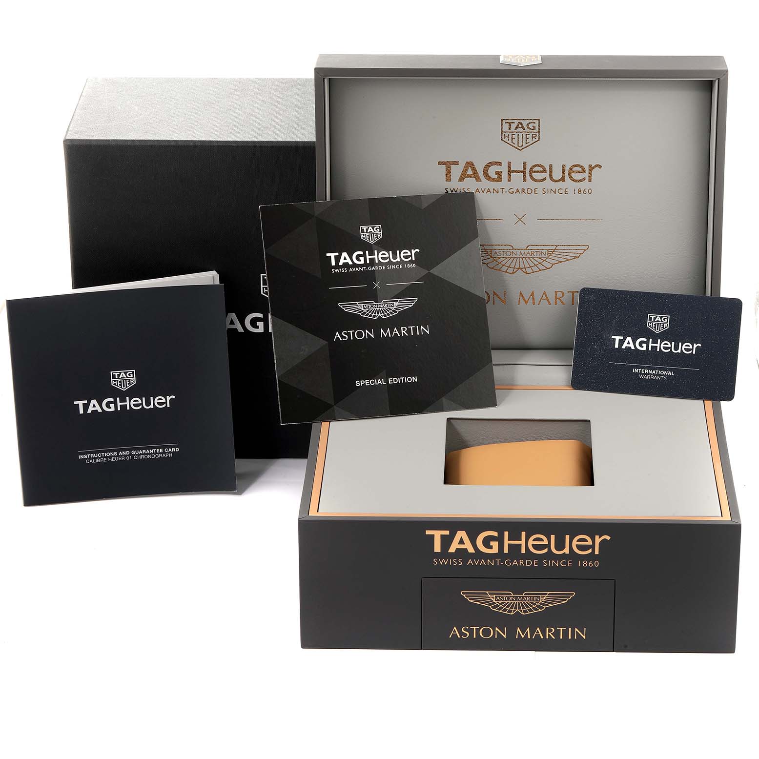 This image shows the packaging, booklets, and international warranty card for the Tag Heuer Carrera CAR2A1AB.FT6163 Men's Stainless Steel Black Dial CAR2A1AB.FT6163 Men's Stainless Steel Black Dial model watch.