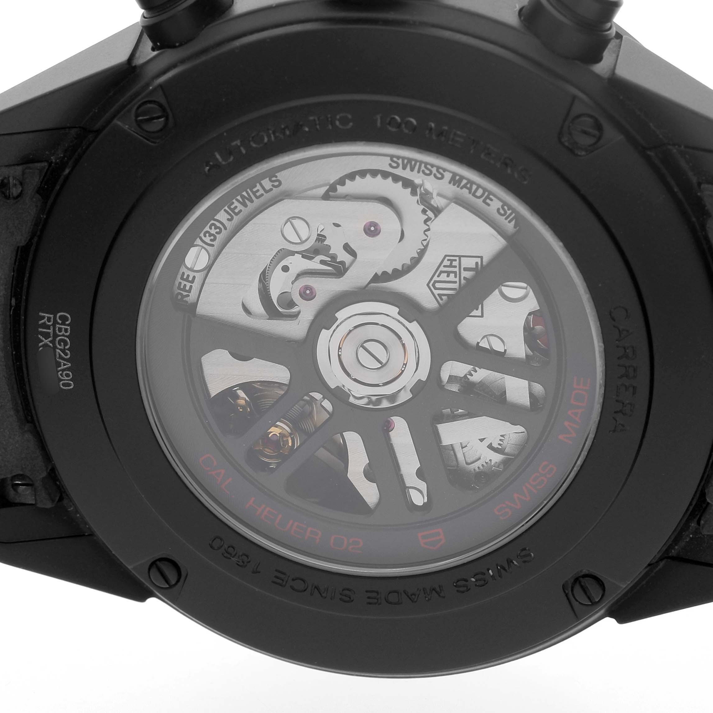The image shows the back of the Tag Heuer Carrera CBG2A90.BH0653 Men's Ceramic Black Dial, highlighting the automatic movement and internal gears.