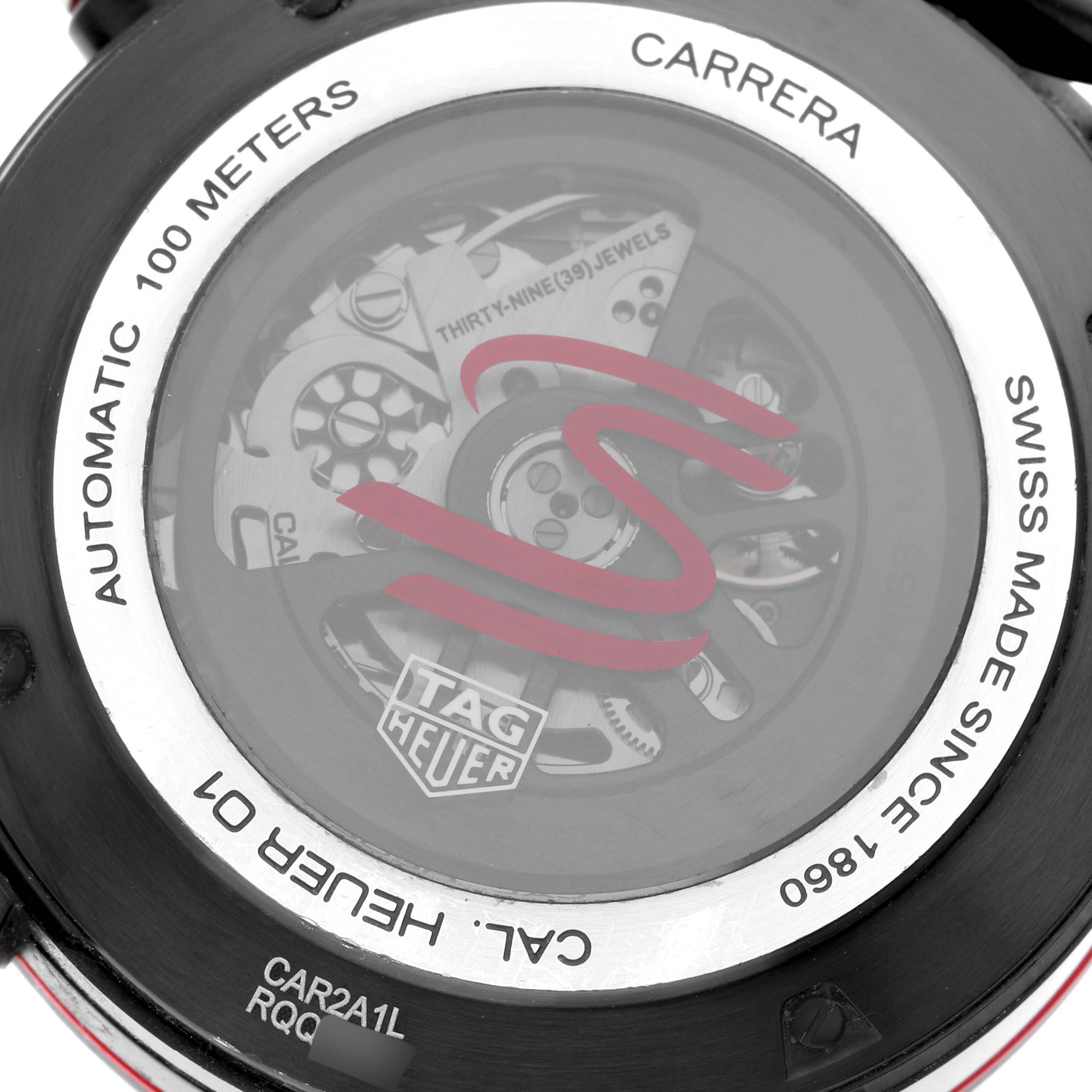 The image shows the case back of a Tag Heuer Carrera CAR2A1L.BA0688 Men's Stainless Steel Grey Dial CAR2A1L.BA0688 Men's Stainless Steel Grey Dial watch, exposing its internal mechanical movement labeled with various technical details.