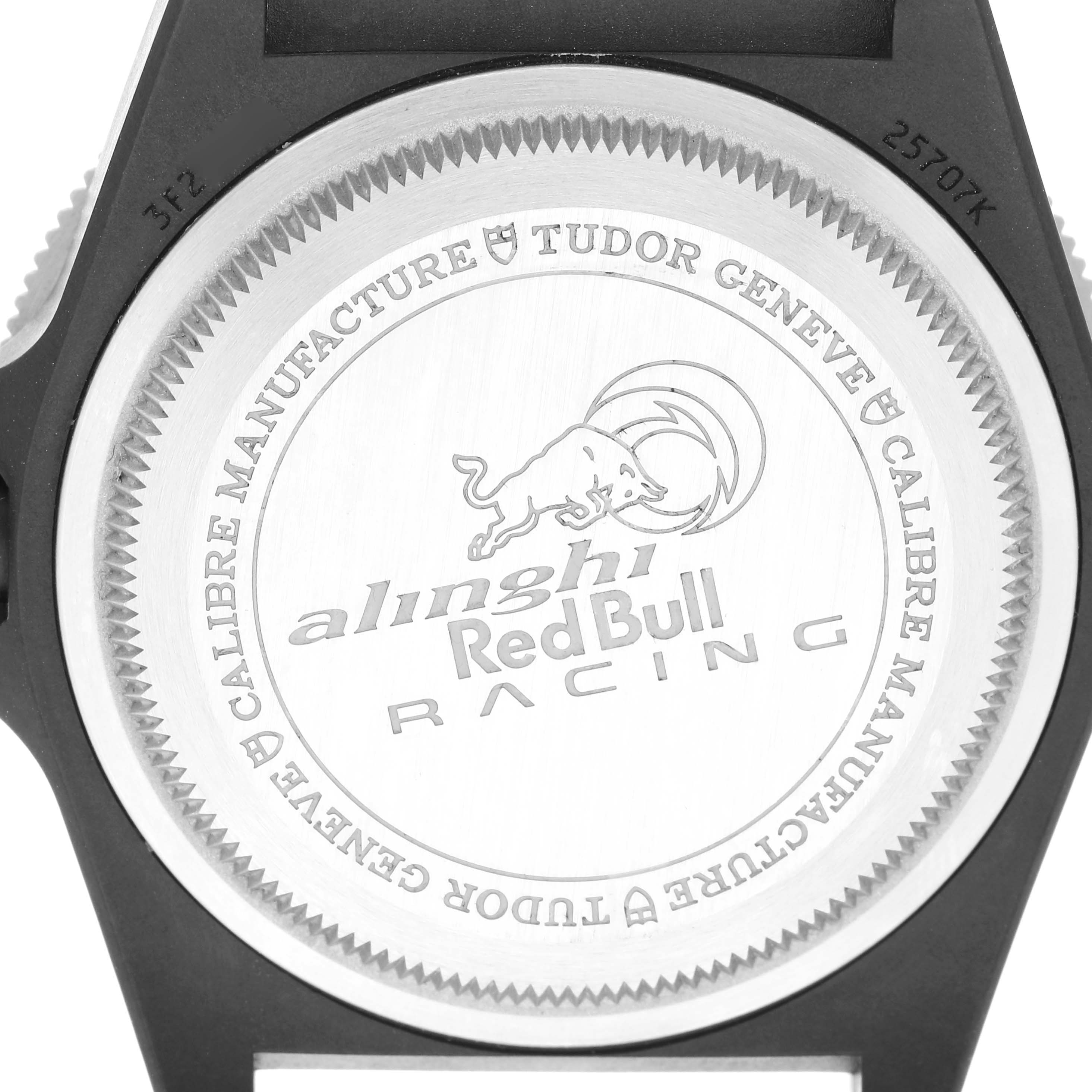 The image shows the back case of a Tudor Pelagos M25707KN-0001 Men
s Stainless Steel Blue Dial M25707KN-0001 Men
s Stainless Steel Blue Dial watch, featuring "Alinghi Red Bull Racing" branding and the manufacturer
s details.